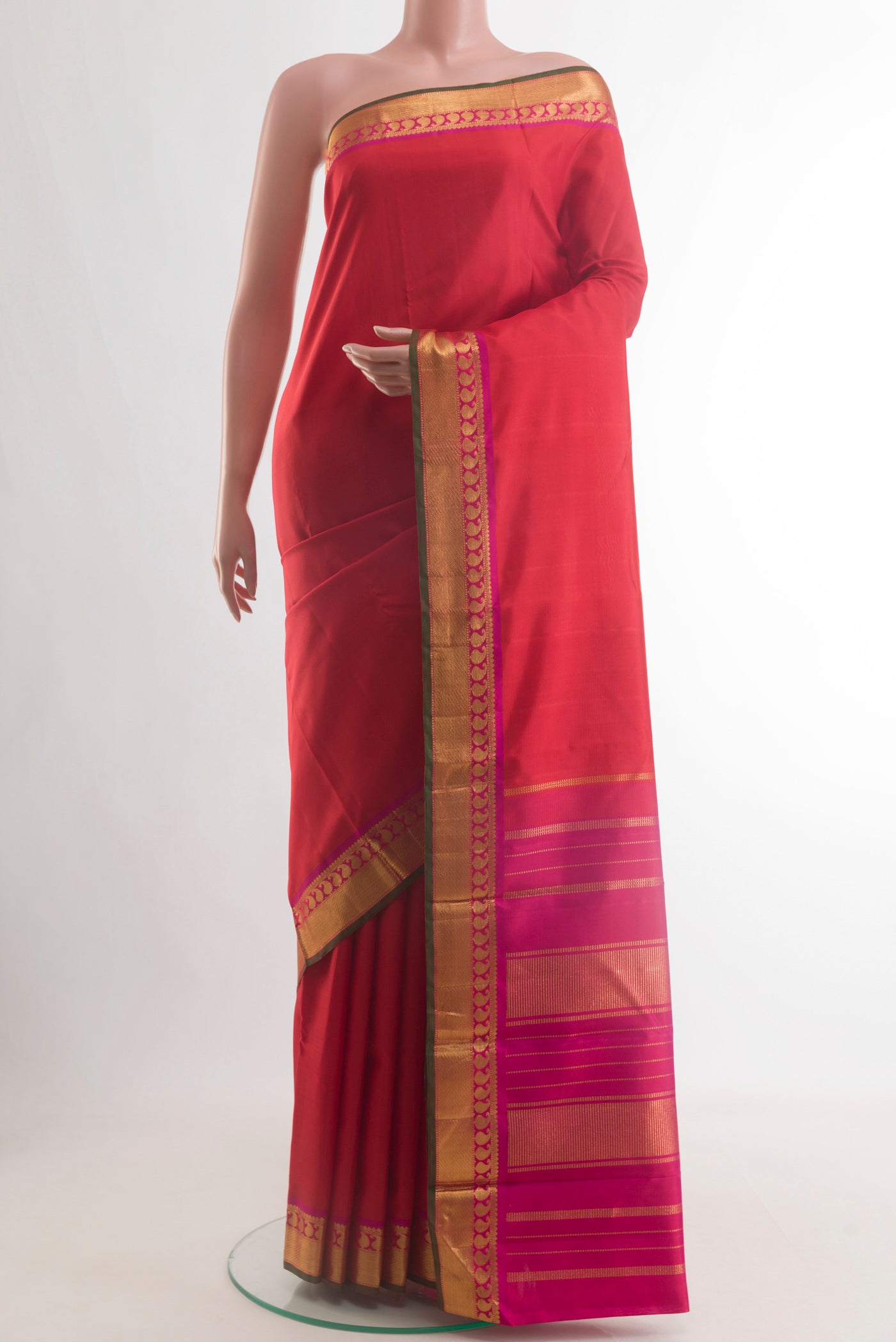 Red Kanchipuram Silk Saree with Plain Body and Zari Border.  displayed on a mannequin