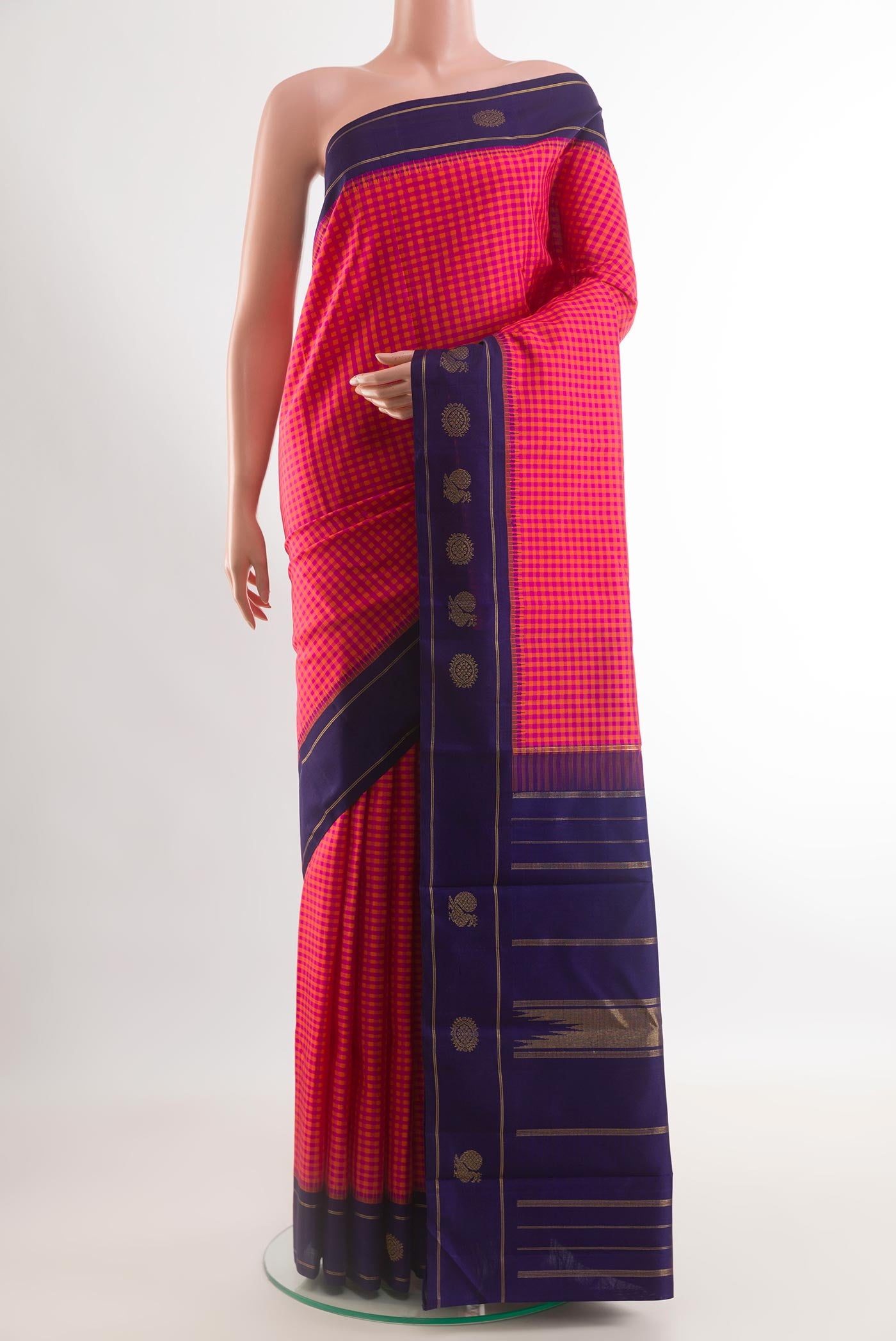 Pink Kanjivaram Silk Saree with Checked design on the body and Zari Border.  displayed on a mannequin