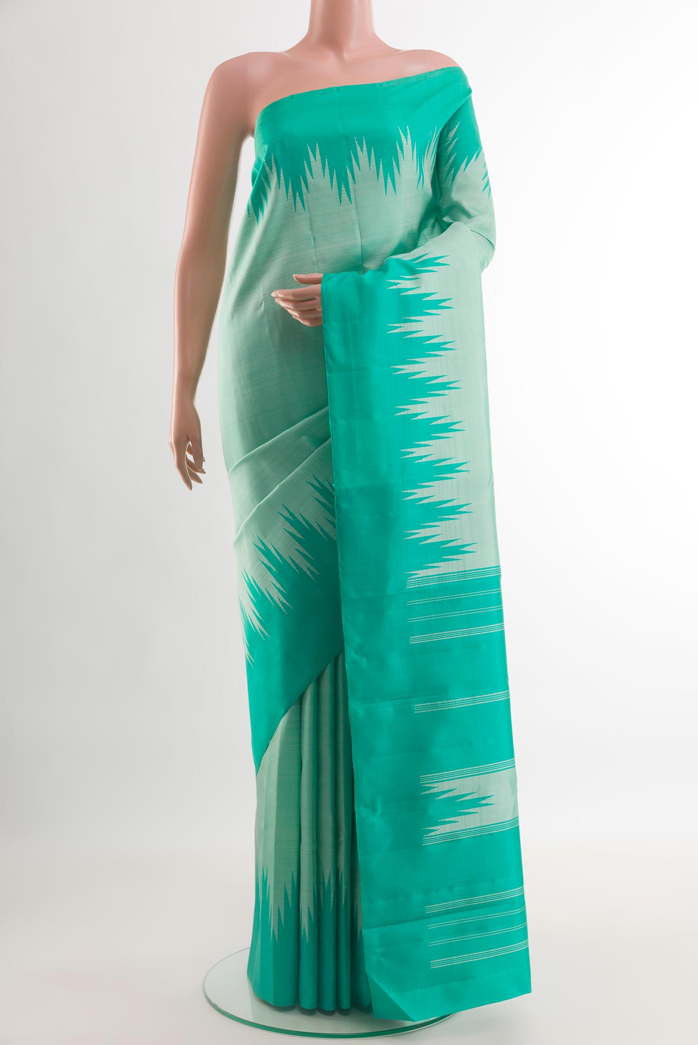 Mint Green Kanjivaram Silk Saree with Plain Body and Temple Border.  displayed on a mannequin
