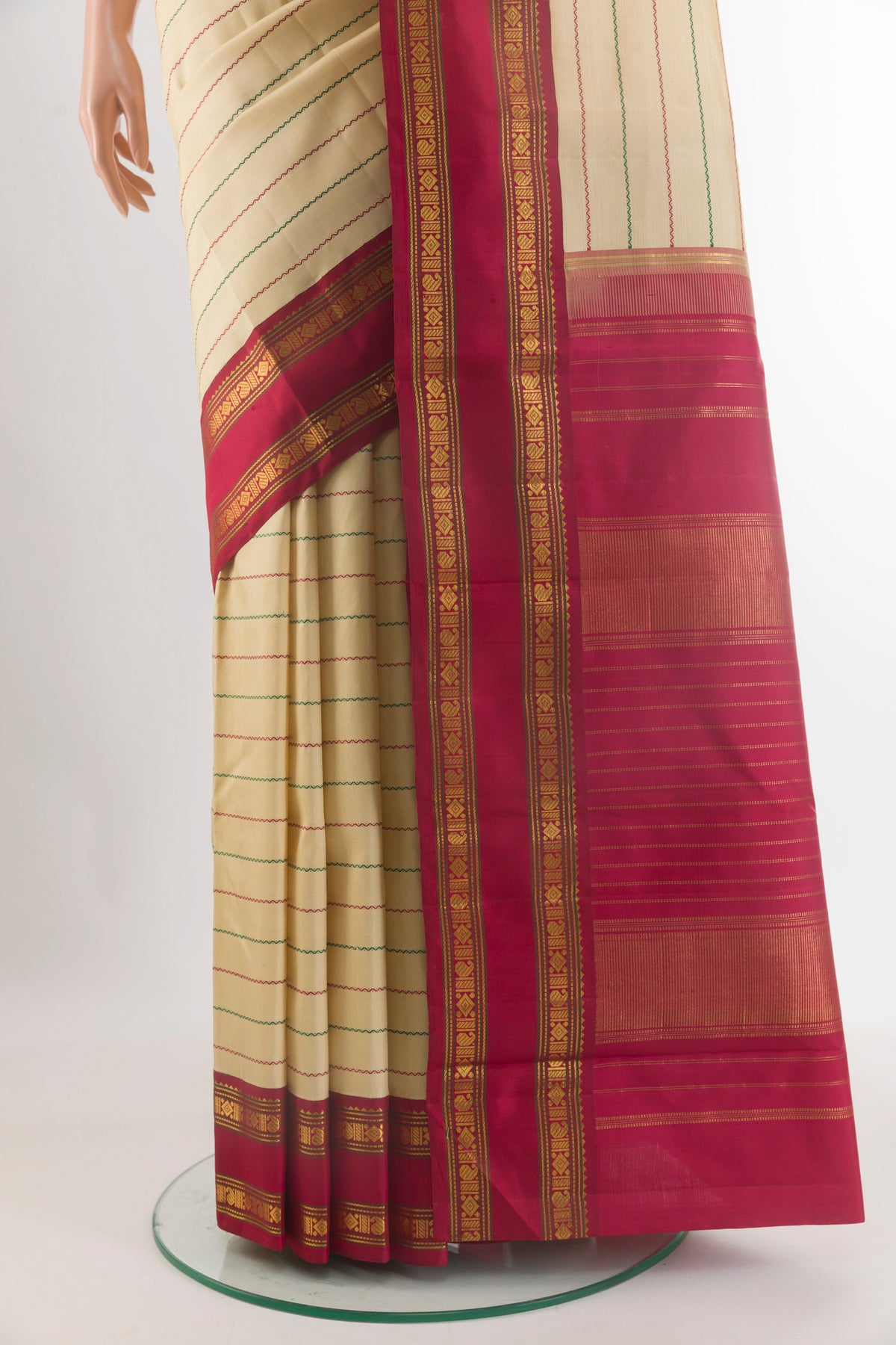 Pleats and pallu of Pure Silk Sandal Kanjivaram Saree with Stripes on the body and Ganga Jamuna Border. 