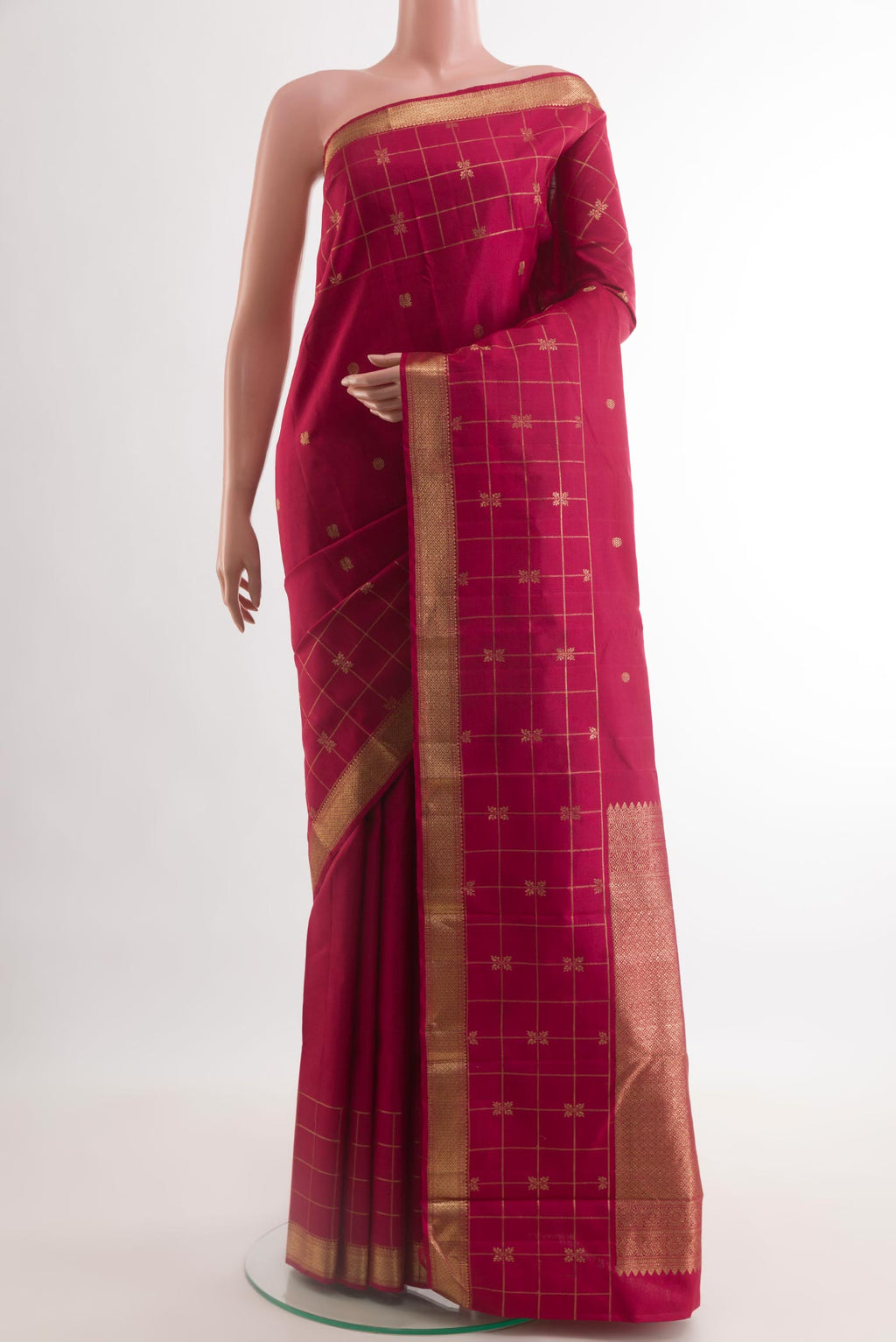 Maroon Kanjivaram Silk Saree with Zari Butta on the body and Zari Border.  displayed on a mannequin