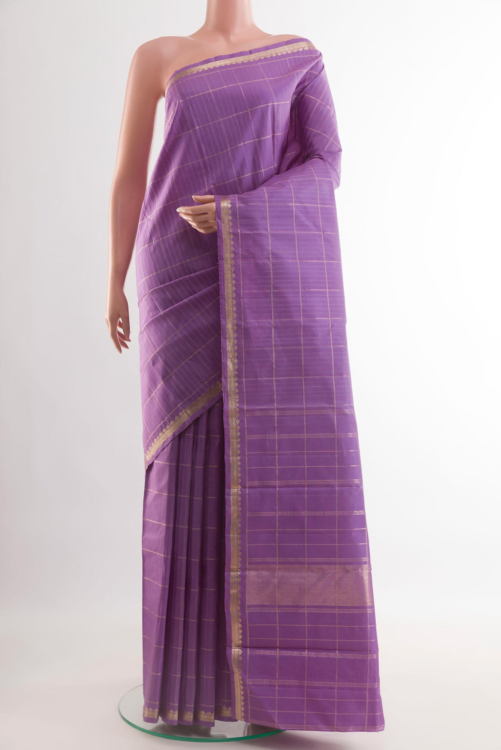 Lavender Kanchipuram Silk Saree with Checked design on the body and Zari Border.  displayed on a mannequin