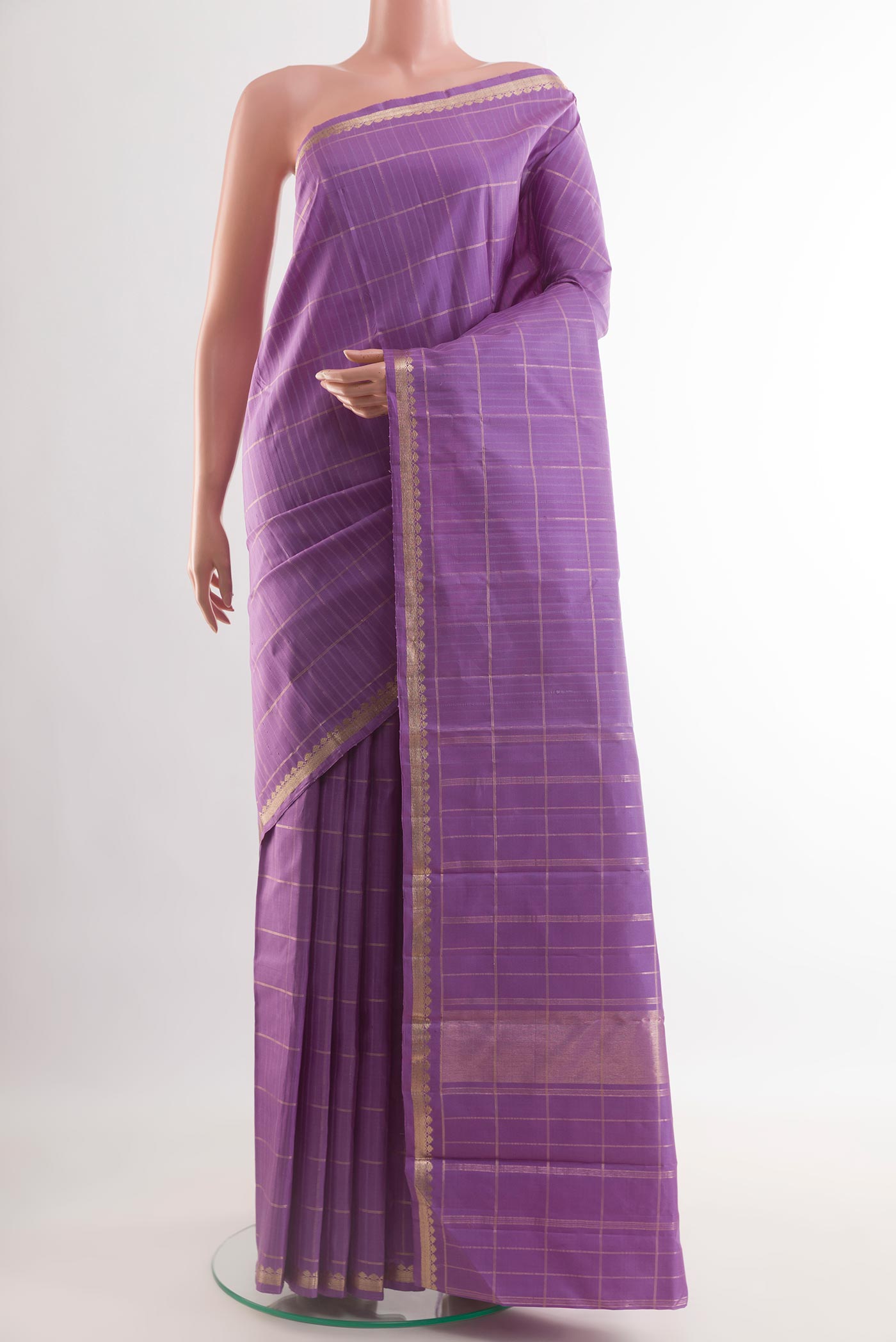 Lavender Kanchipuram Silk Saree with Checked design on the body and Zari Border.  displayed on a mannequin