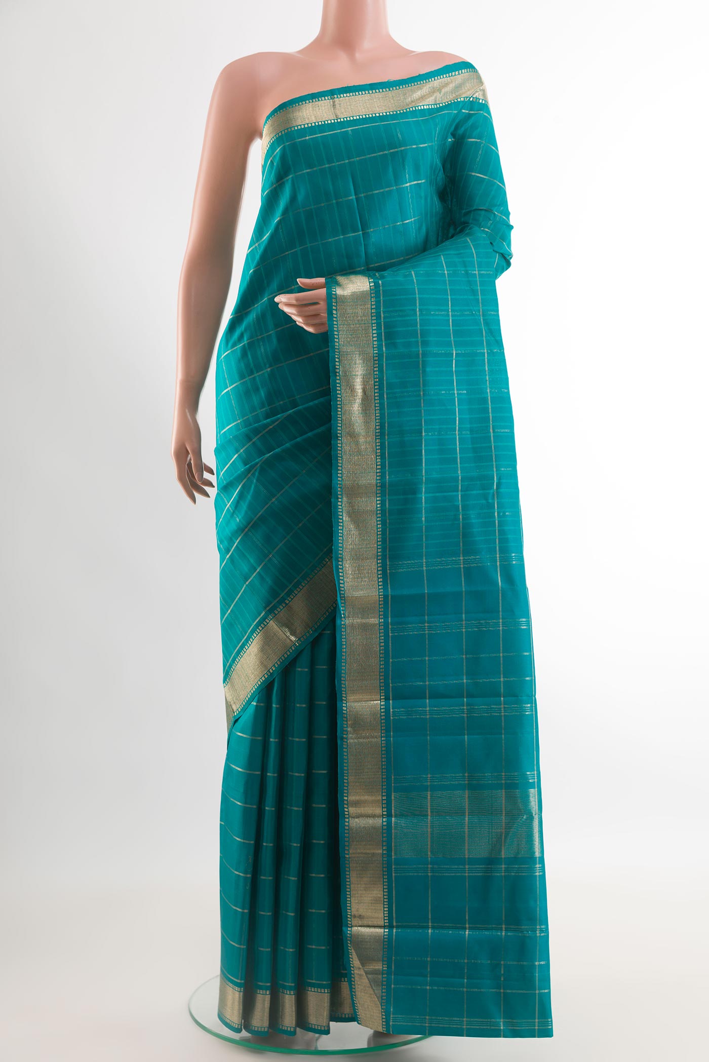 Sea Green Kanchipuram Silk Saree with Checked design on the body and Zari Border.  displayed on a mannequin