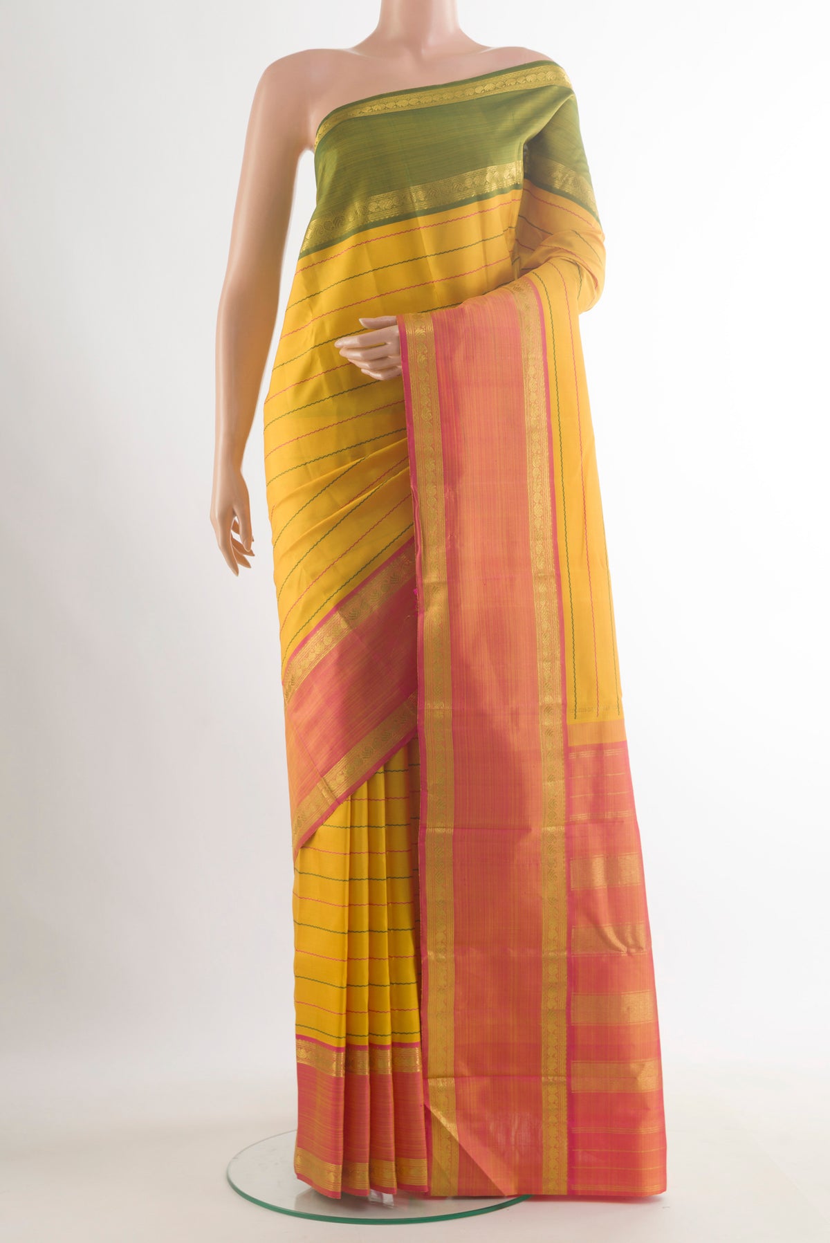 Pure Silk Yellow Kanchipuram Saree with Stripes on the body and Ganga Jamuna Border.  displayed on a mannequin