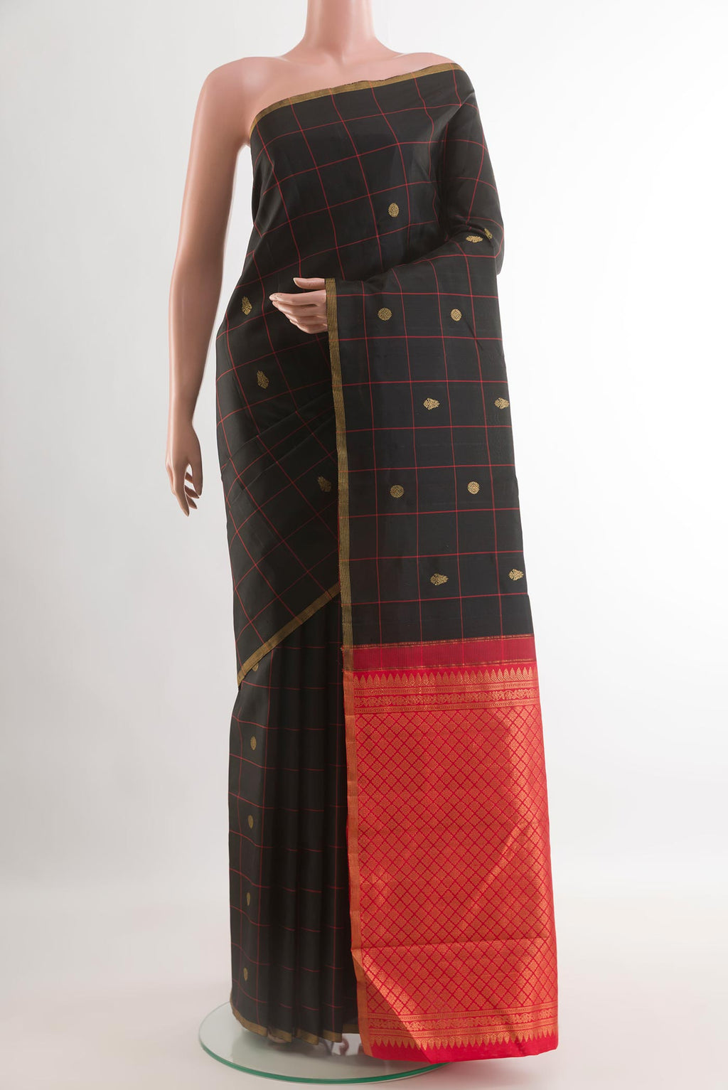Black Kanchipuram Silk Saree with Checked design on the body and Zari Border.  displayed on a mannequin