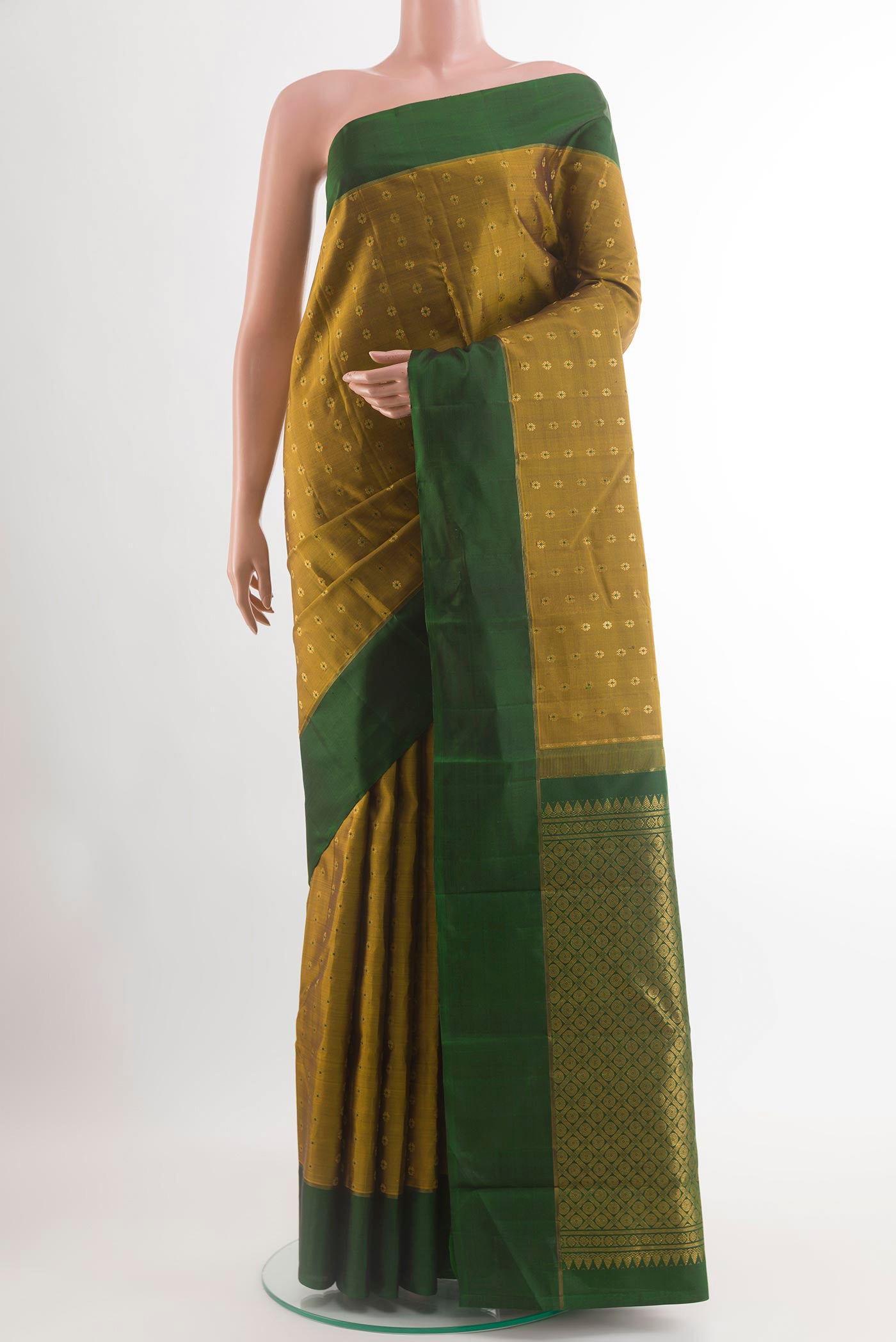 Mehandi Green Kanchipuram Silk Saree with Checked design on the body and Zari Border.  displayed on a mannequin