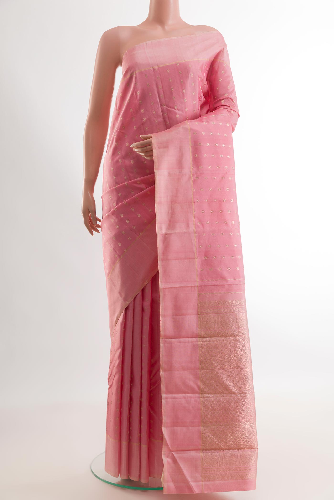 Rose pink Kanchipuram Silk Saree with Zari Butta on the body and Zari Border.  displayed on a mannequin