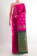 Rani Pink Kanchipuram Silk Saree with Zari Butta on the body and Without Border.  displayed on a mannequin