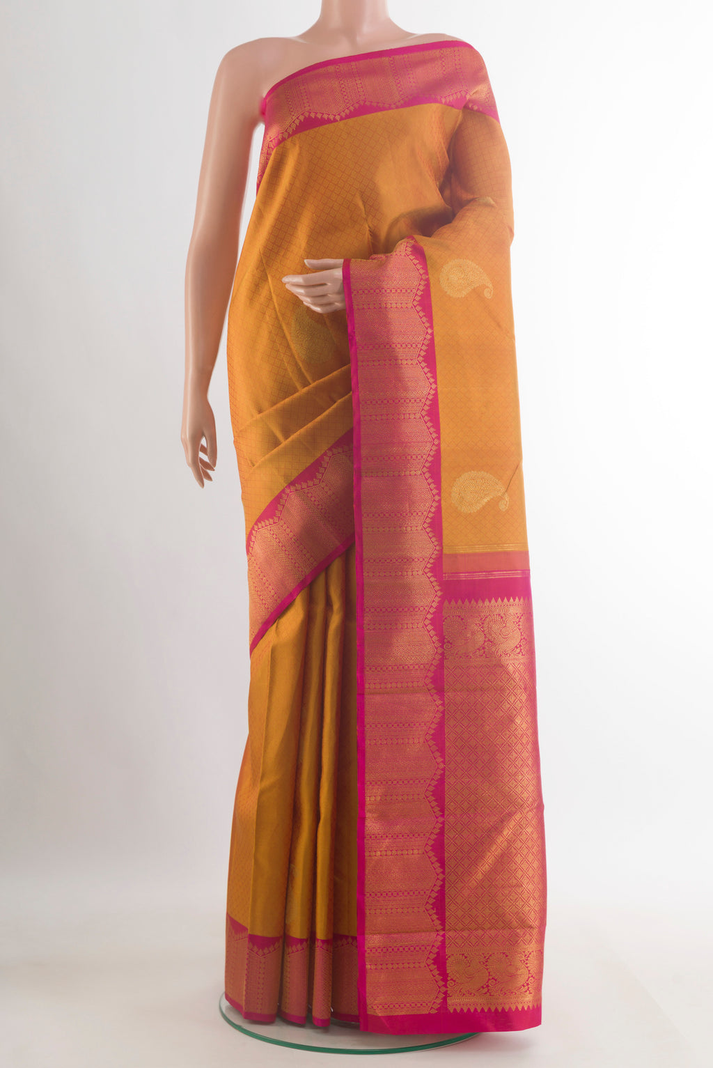 Pure Silk Mustard Kanchipuram Saree with Jacquard With Zari Butta on the body and Zari Border.  displayed on a mannequin