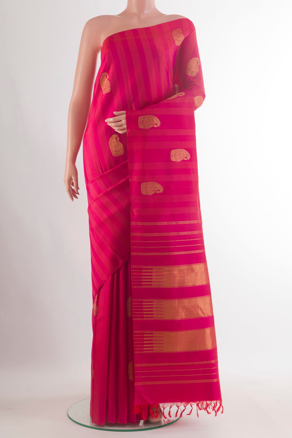 Pure Silk Pink Kanjivaram Saree with Zari Butta on the body and Without Border.  displayed on a mannequin