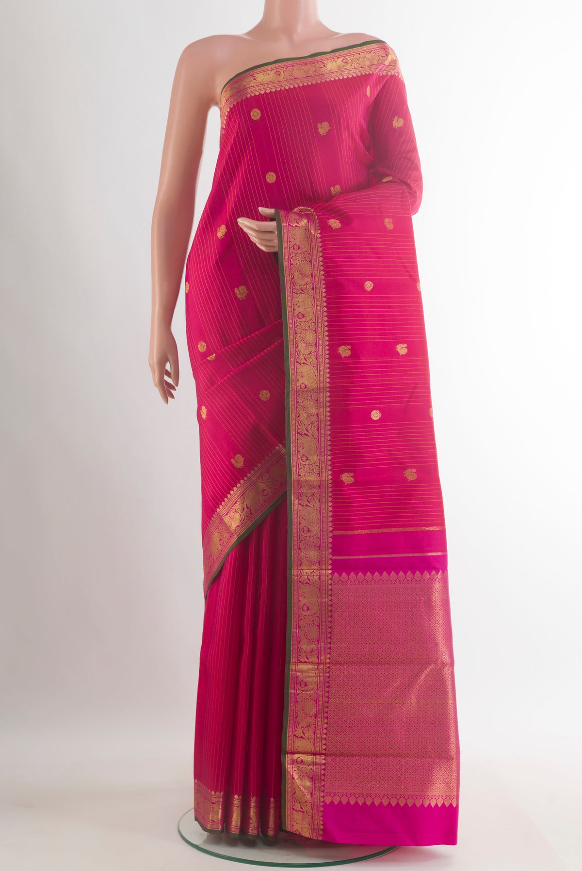 Pure Silk Pink Kanjivaram Saree with Zari Butta on the body and Temple Border.  displayed on a mannequin