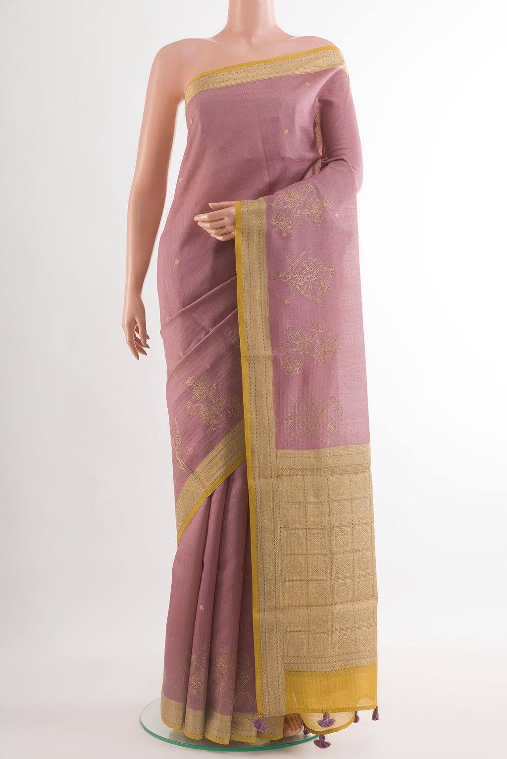Lavender Tussar Silk Saree with Embroidery on the body and Embroidery Border.  displayed on a mannequin
