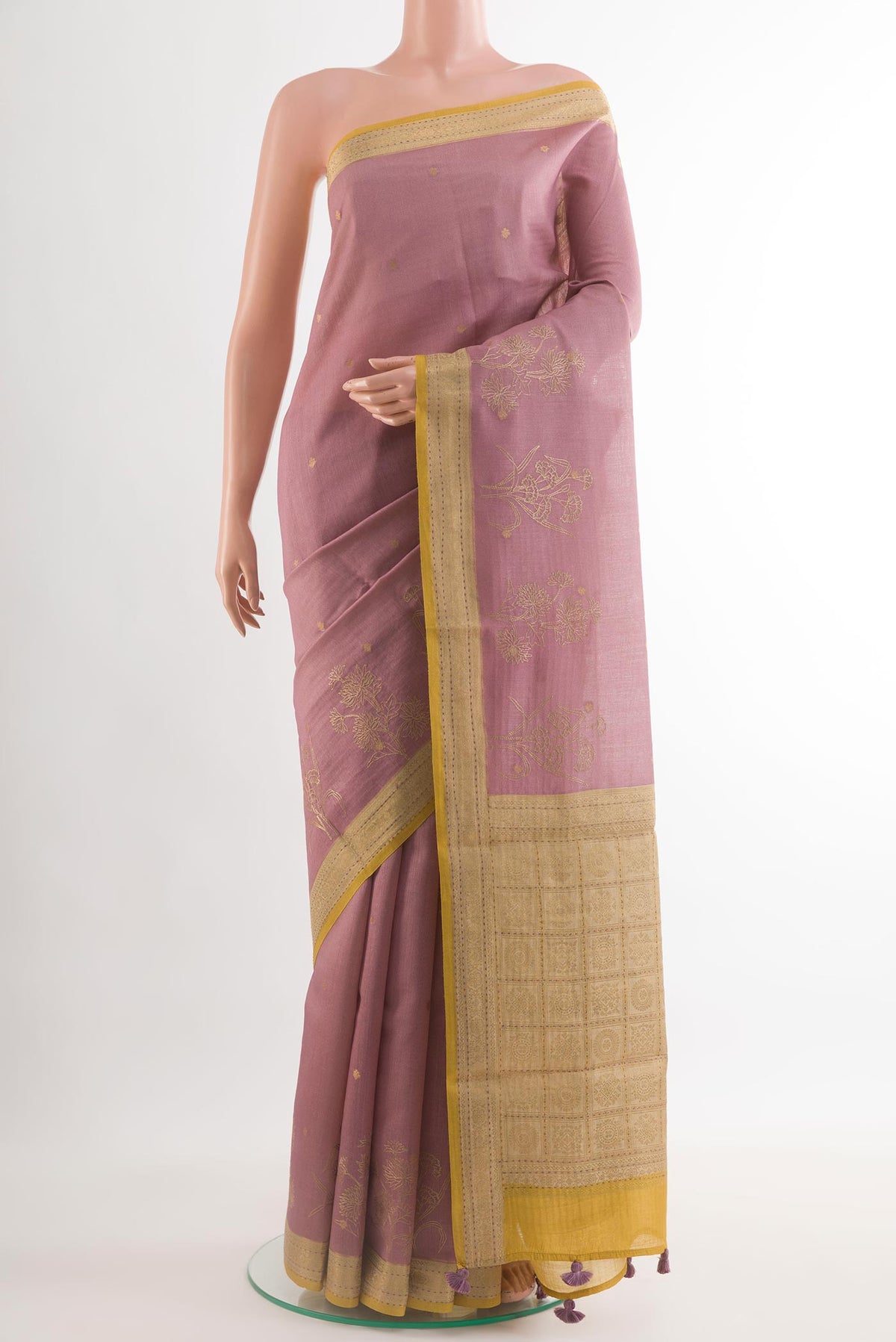 Lavender Tussar Silk Saree with Embroidery on the body and Embroidery Border.  displayed on a mannequin