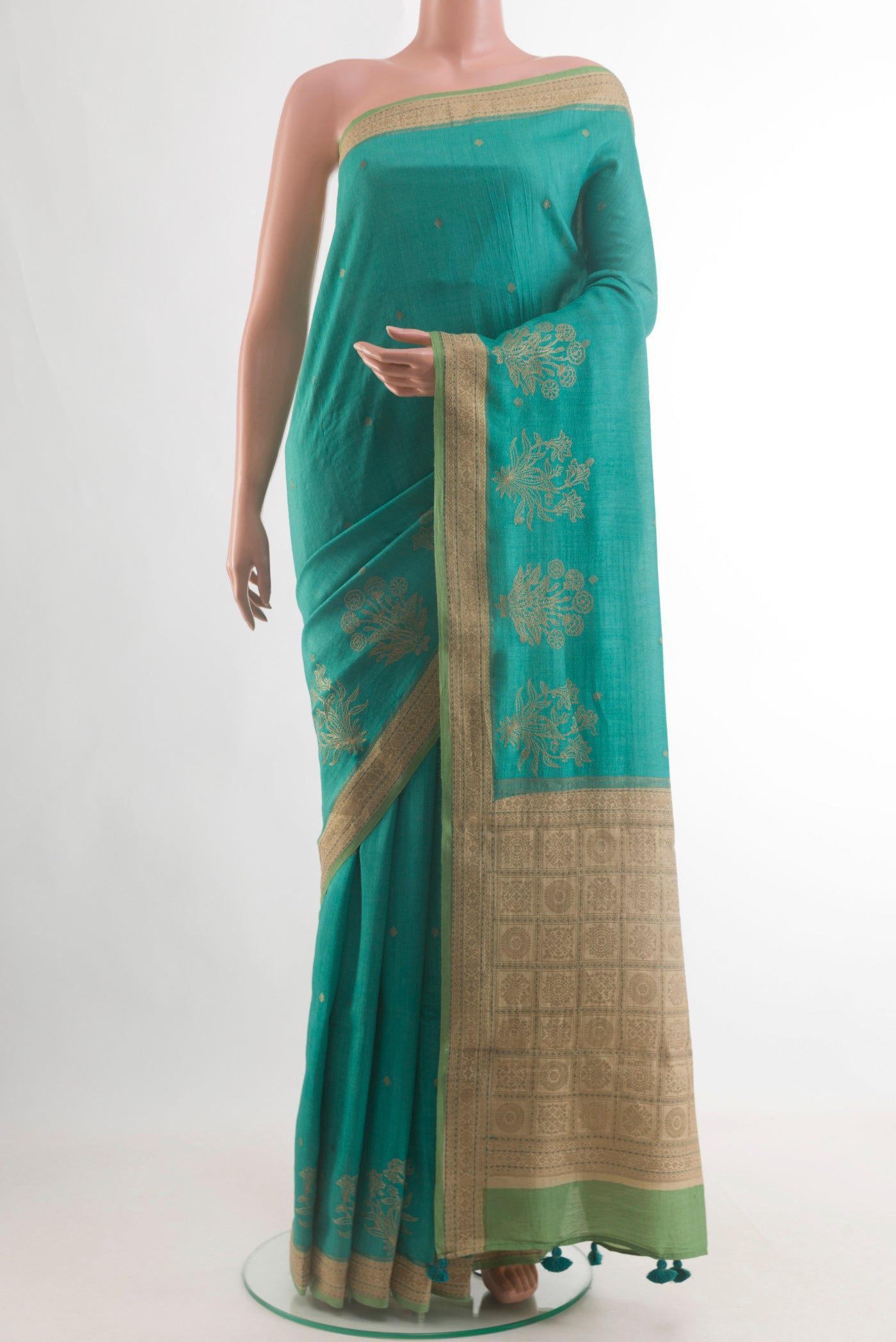 Blue Tussar Saree with Zari Butta on the body and Zari Border.  displayed on a mannequin