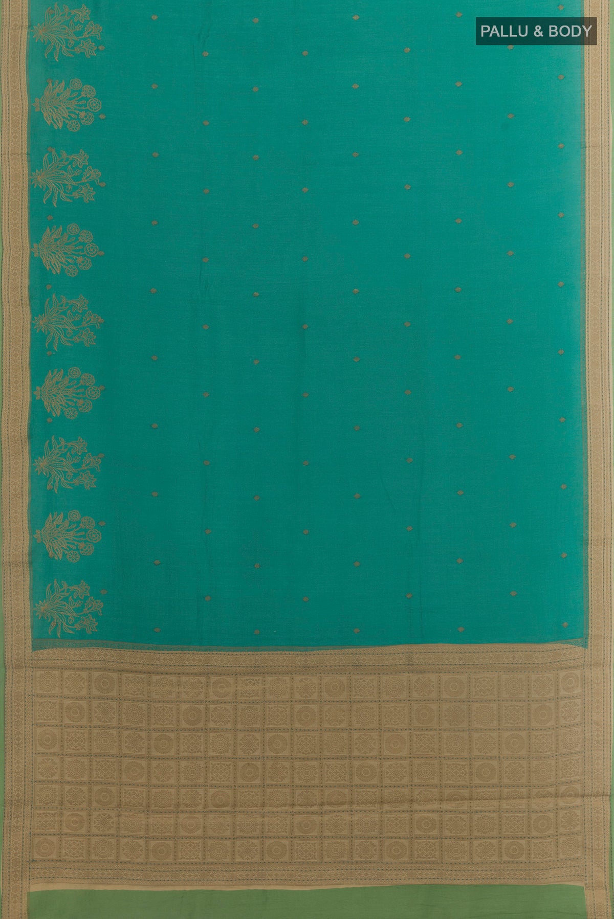 Flat view of Blue Tussar Saree with Zari Butta on the body and Zari Border. 