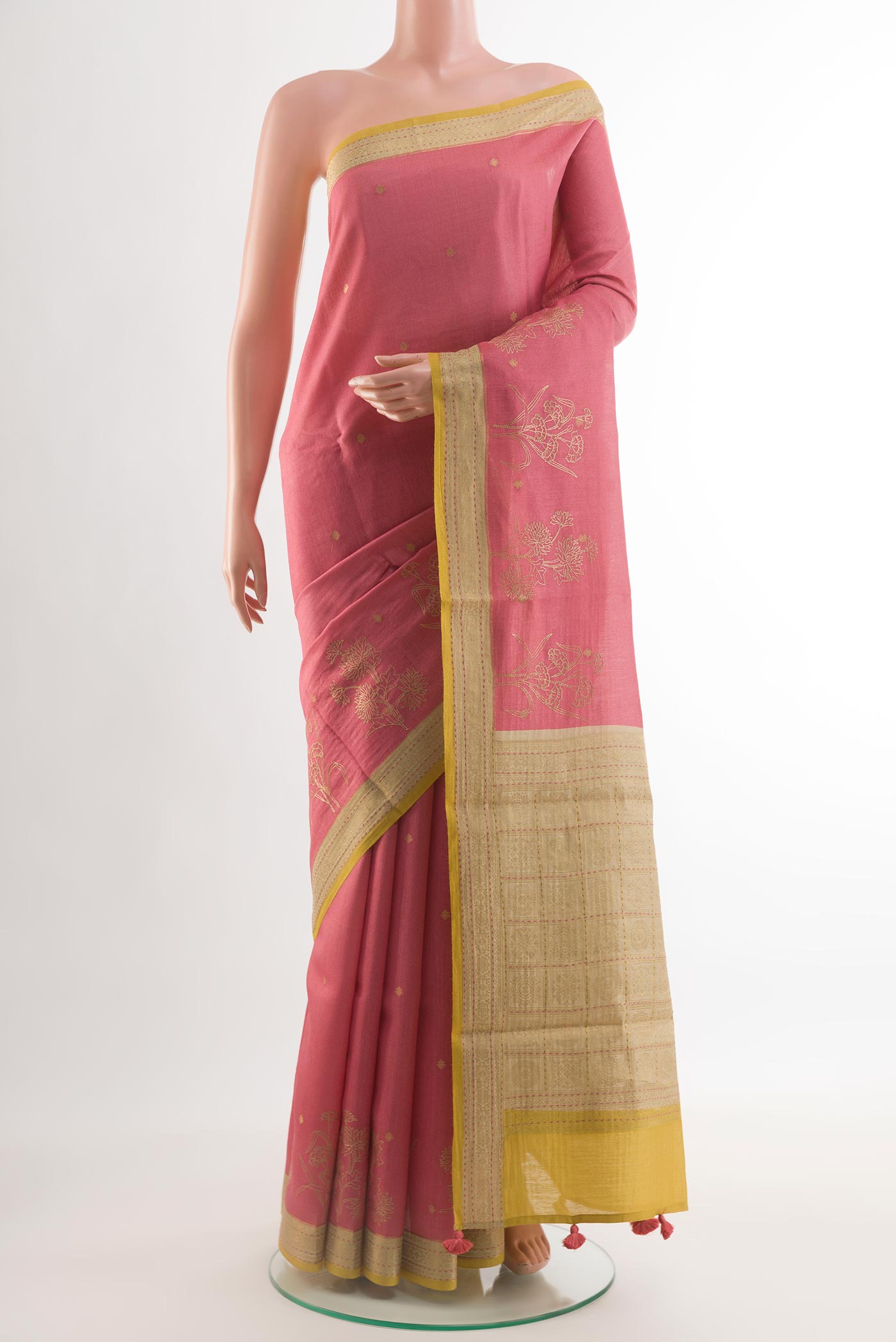 Coral Tussar Silk Saree with Embroidery on the body and Zari Border.  displayed on a mannequin