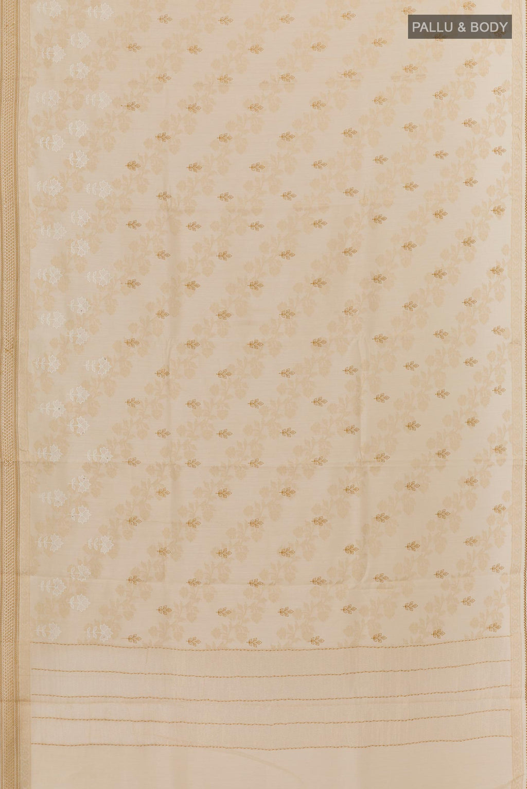 Flat view of Cream Tussar Silk Saree with Embroidery on the body and Zari Border. 