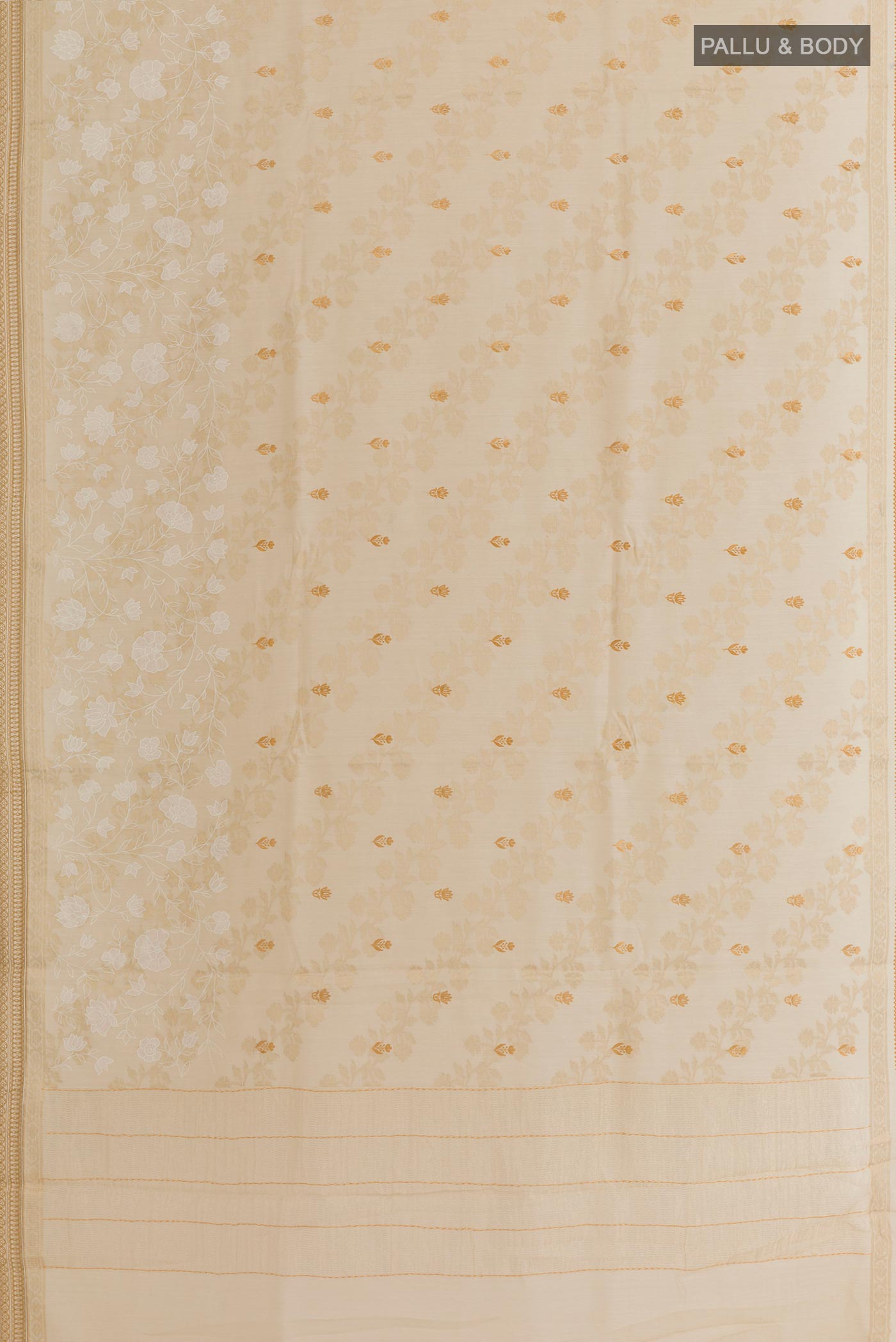 Flat view of Cream Tussar Silk Saree with Embroidery on the body and Zari Border. 