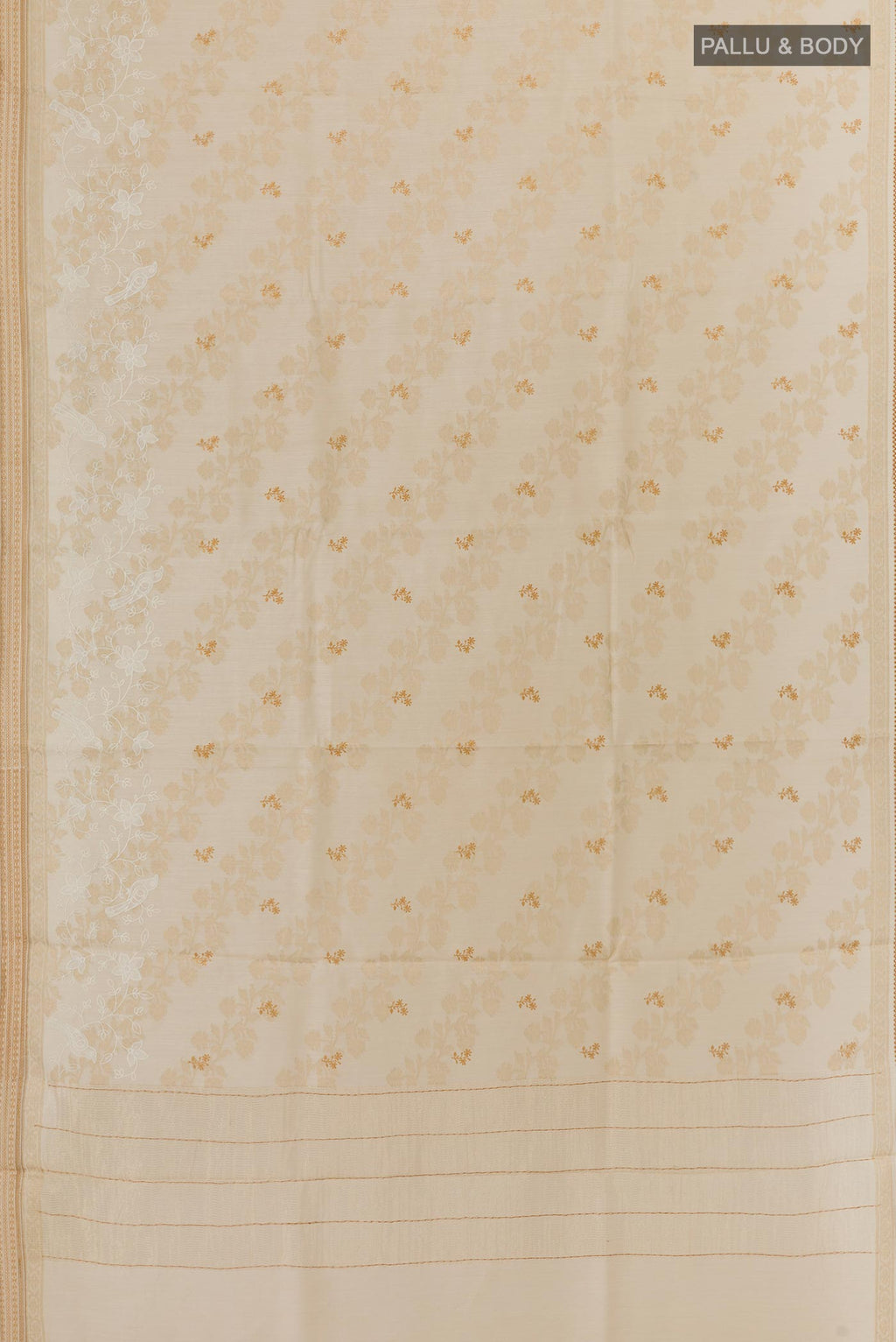 Flat view of Cream Tussar Silk Saree with Embroidery on the body and Zari Border. 