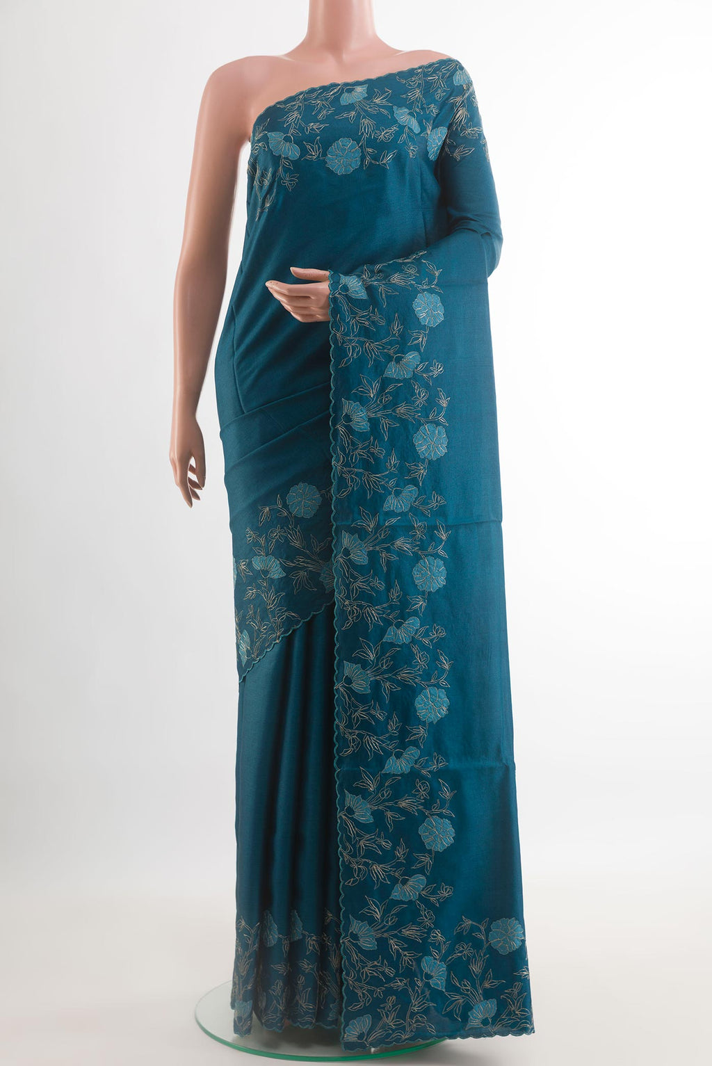 Blue Tussar Silk Saree with Plain Body and Embroidery Border.  displayed on a mannequin