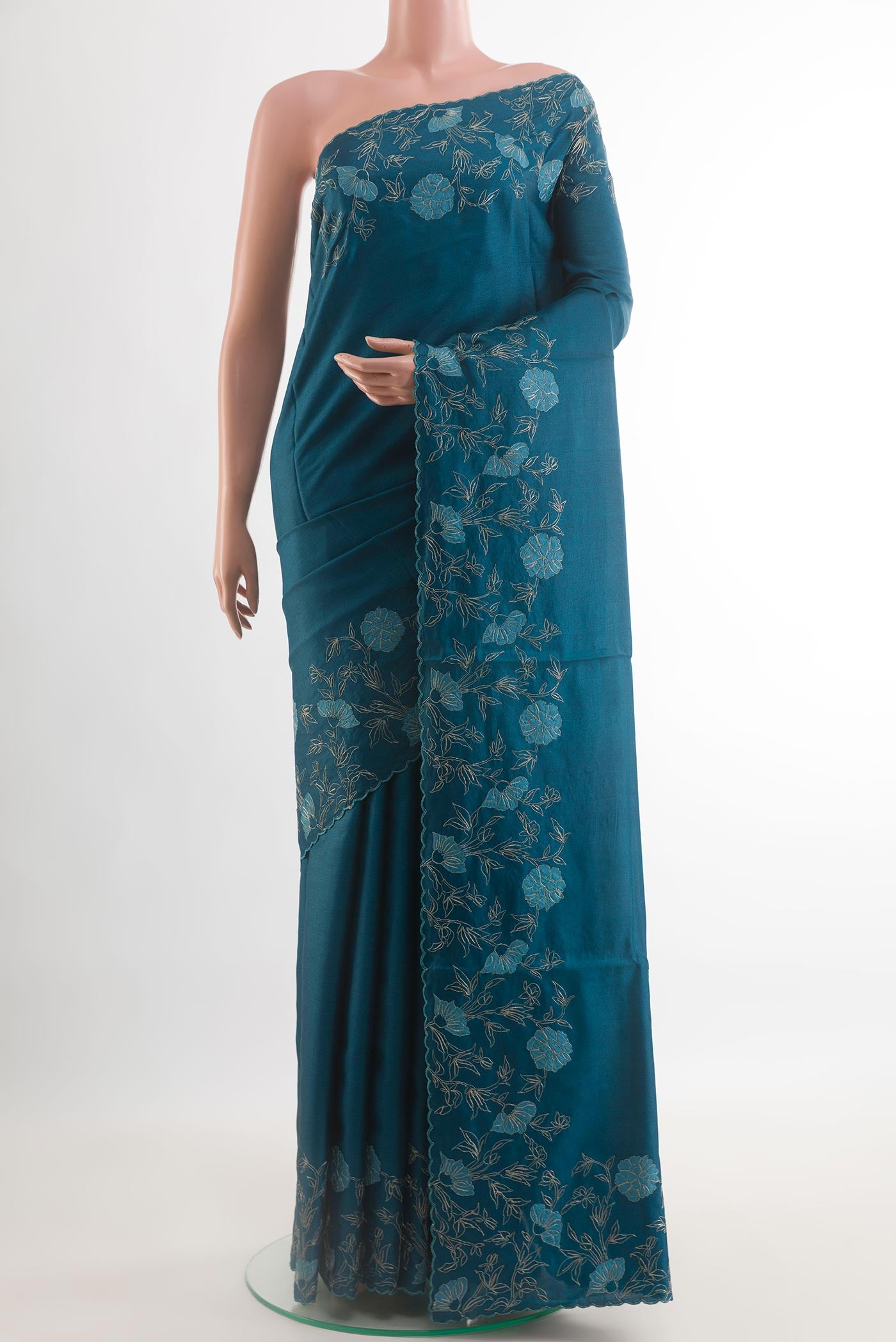 Blue Tussar Silk Saree with Plain Body and Embroidery Border.  displayed on a mannequin