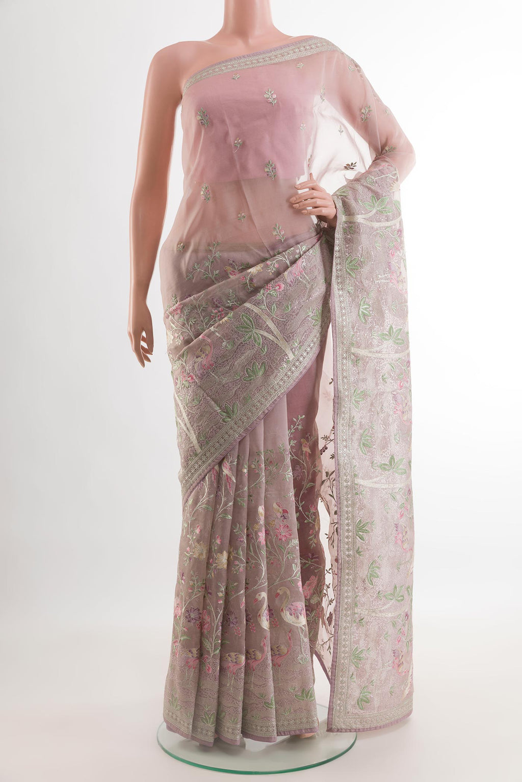 Lavender Organza Silk Saree with Embroidery on the body and Embroidery Border.  displayed on a mannequin