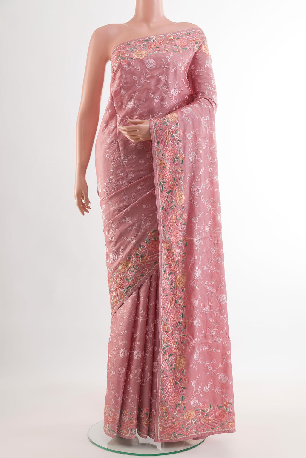 Pink Tussar Silk Saree with Embroidery on the body and Embroidery Border.  displayed on a mannequin