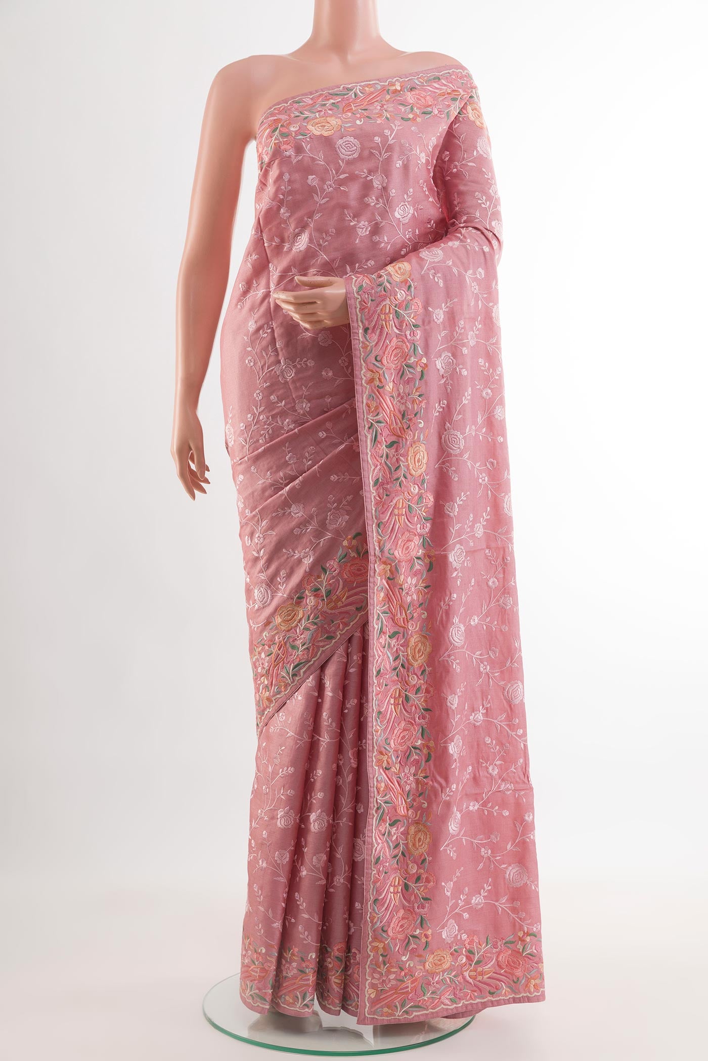 Pink Tussar Silk Saree with Embroidery on the body and Embroidery Border.  displayed on a mannequin