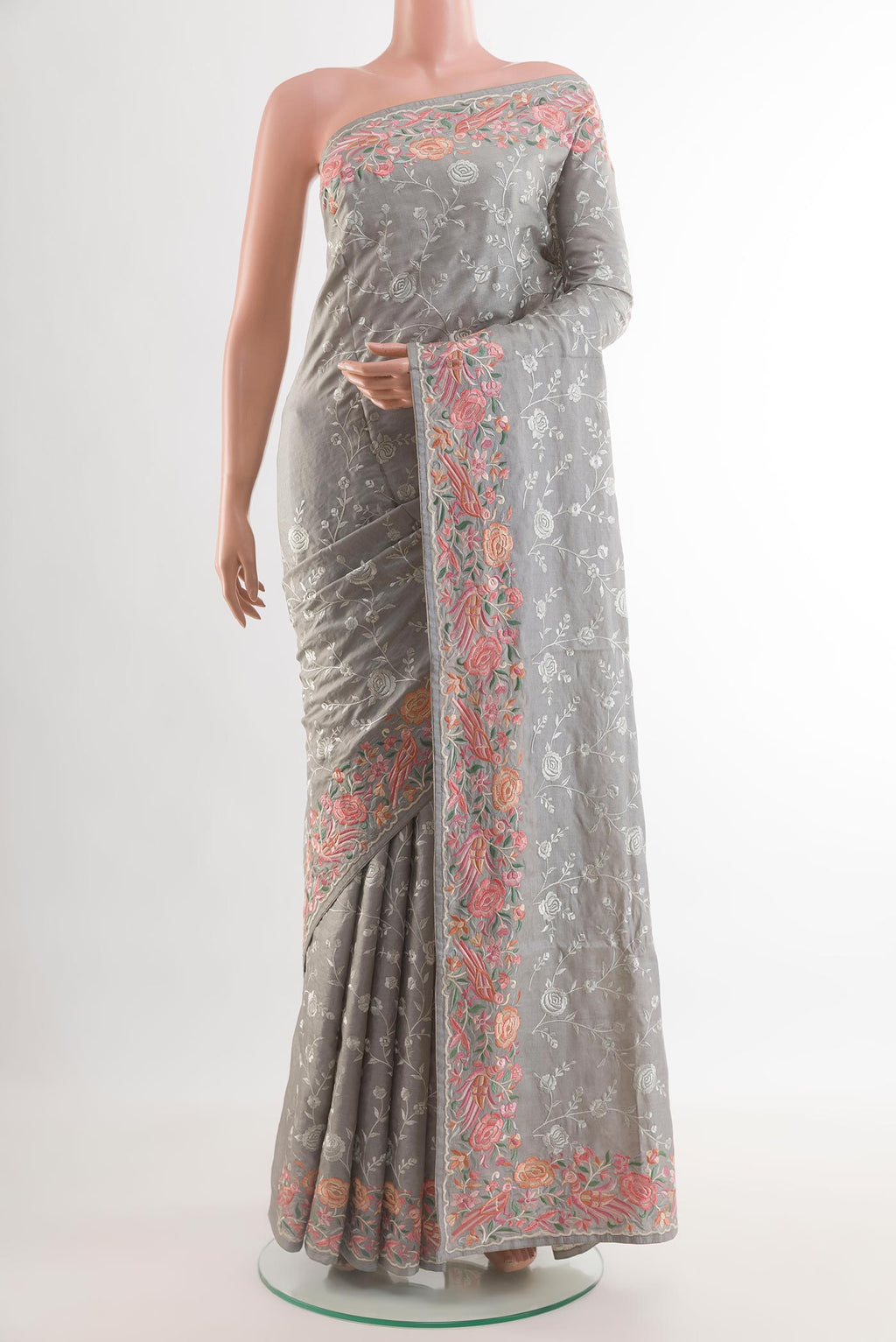 Grey Tussar Silk Saree with Embroidery on the body and Embroidery Border.  displayed on a mannequin