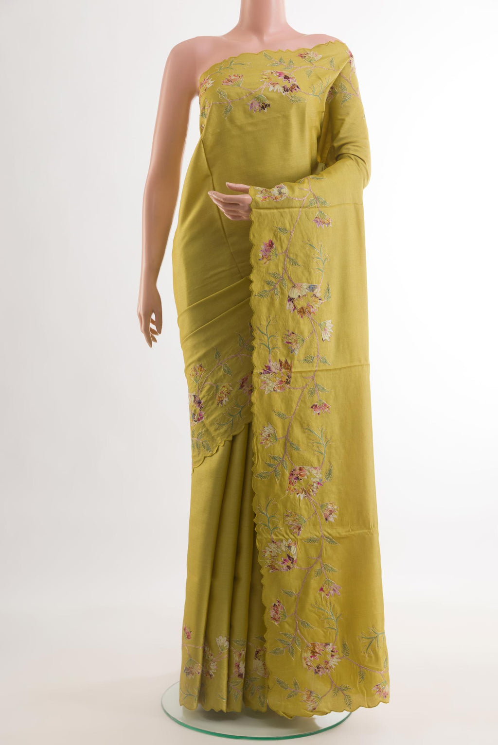 Yellow Tussar Silk Saree with Embroidery on the body and Embroidery Border.  displayed on a mannequin