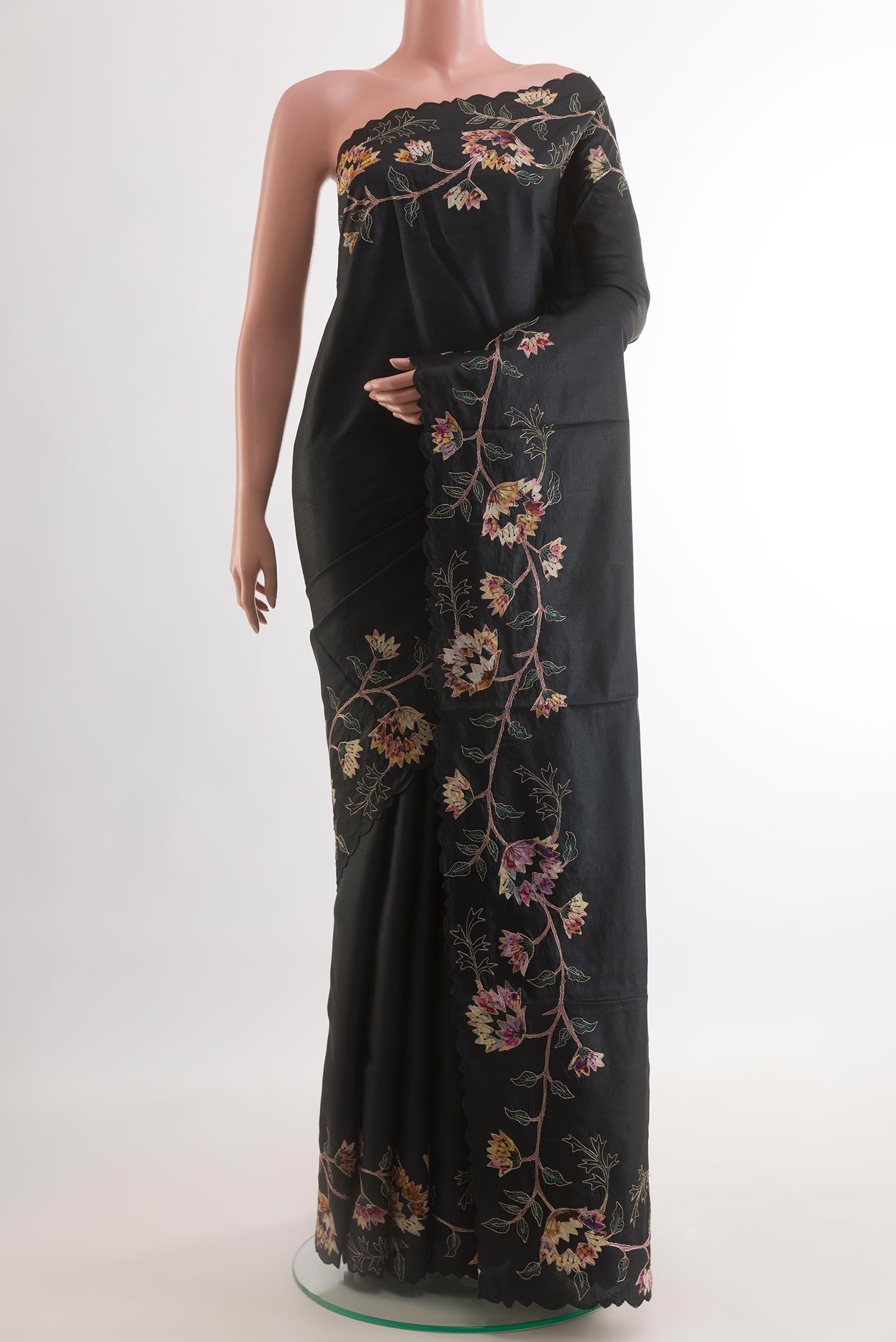Black Tussar Silk Saree with Embroidery on the body and Embroidery Border.  displayed on a mannequin