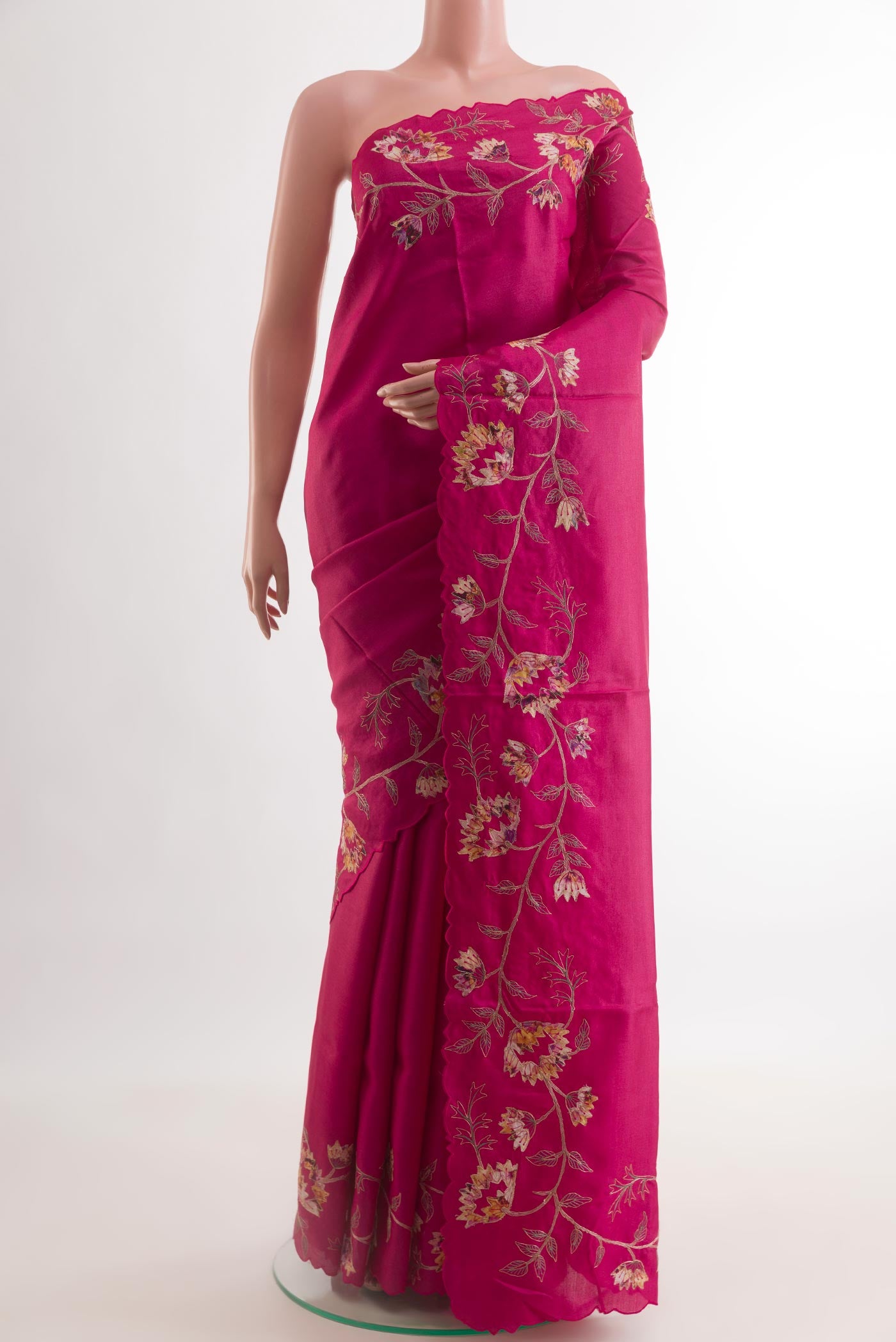 Pink Tussar Silk Saree with Embroidery on the body and Embroidery Border.  displayed on a mannequin
