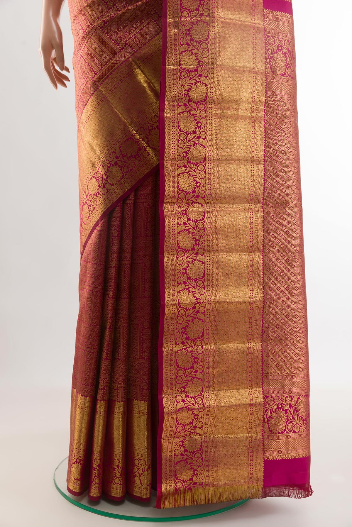 Pleats and pallu of Magenta Kanchipuram Silk Saree with Zari Butta on the body and Zari Border. 