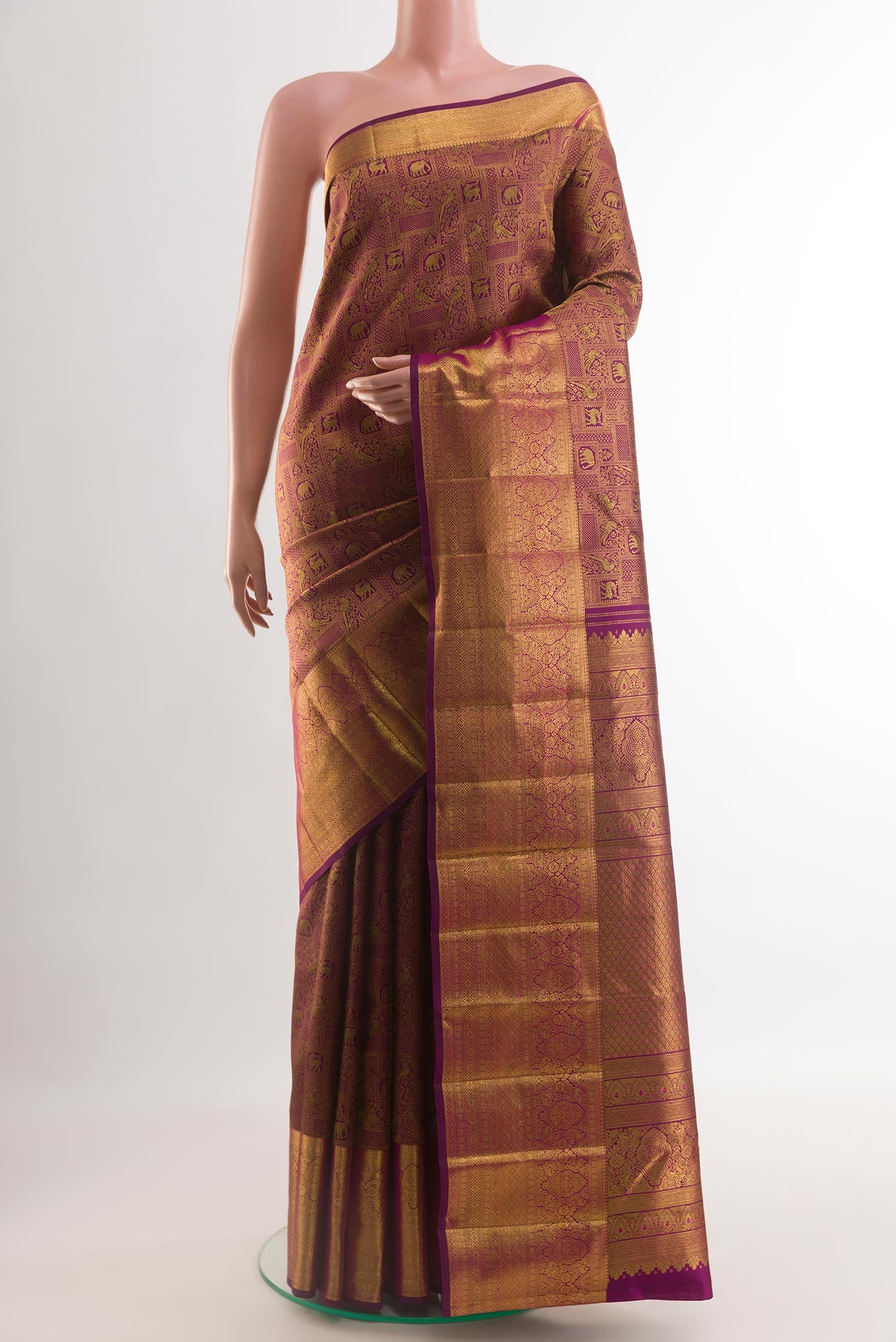 Purple Kanchipuram Silk Saree with Zari Brocade on the body and Zari Border.  displayed on a mannequin