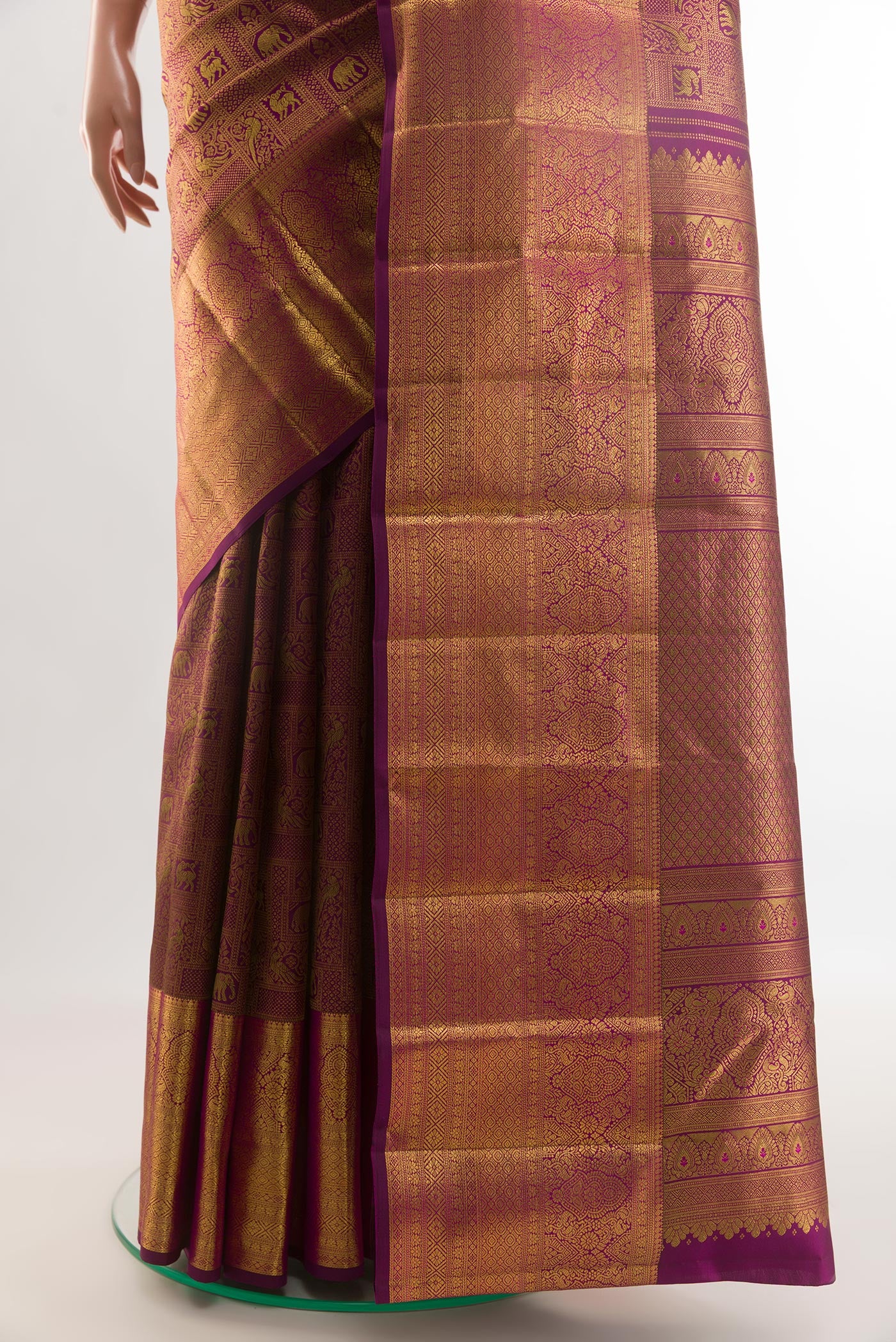 Pleats and pallu of Purple Kanchipuram Silk Saree with Zari Brocade on the body and Zari Border. 