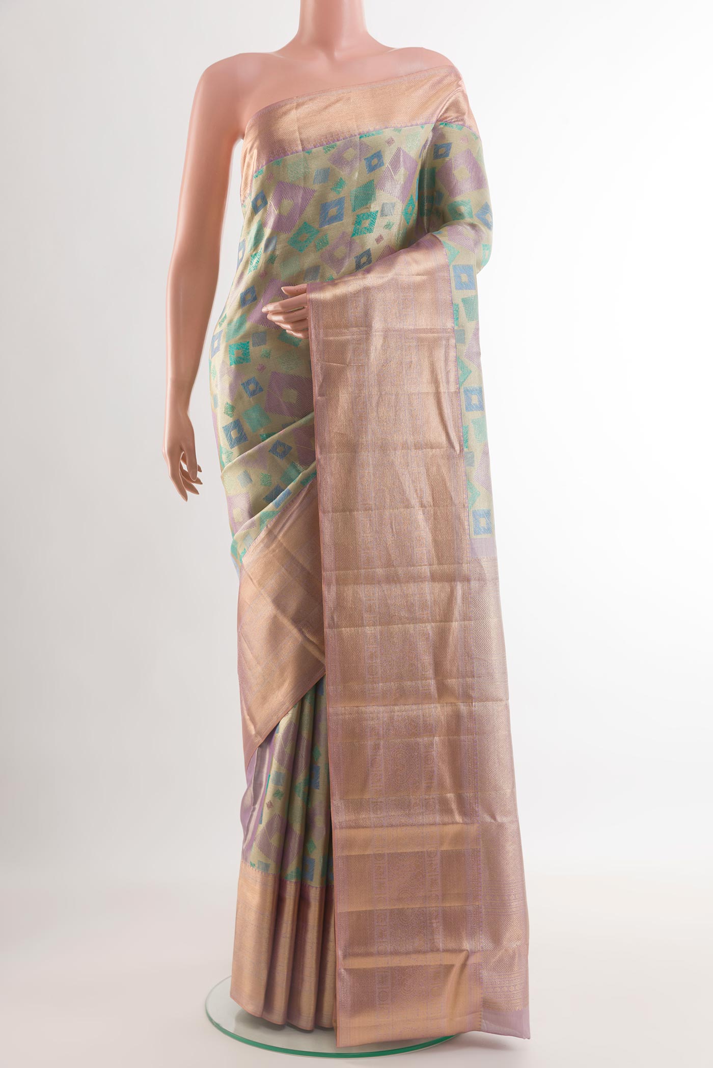 Multi Color Kanjivaram Tissue Silk Saree with Zari Brocade on the body and Zari Border.  displayed on a mannequin