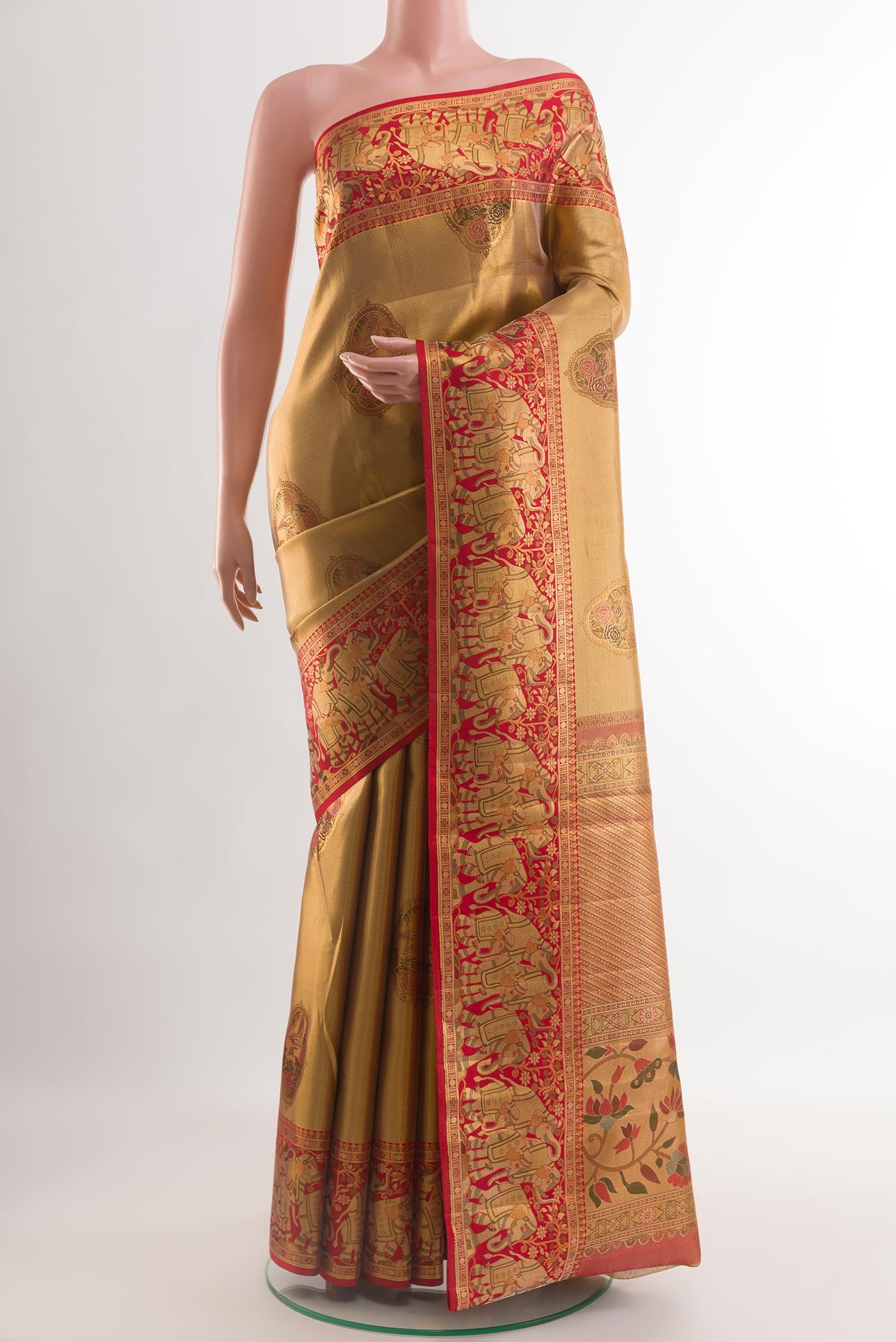 Golden Kanchipuram Tissue Silk Saree with Zari Brocade on the body and Zari Border.  displayed on a mannequin