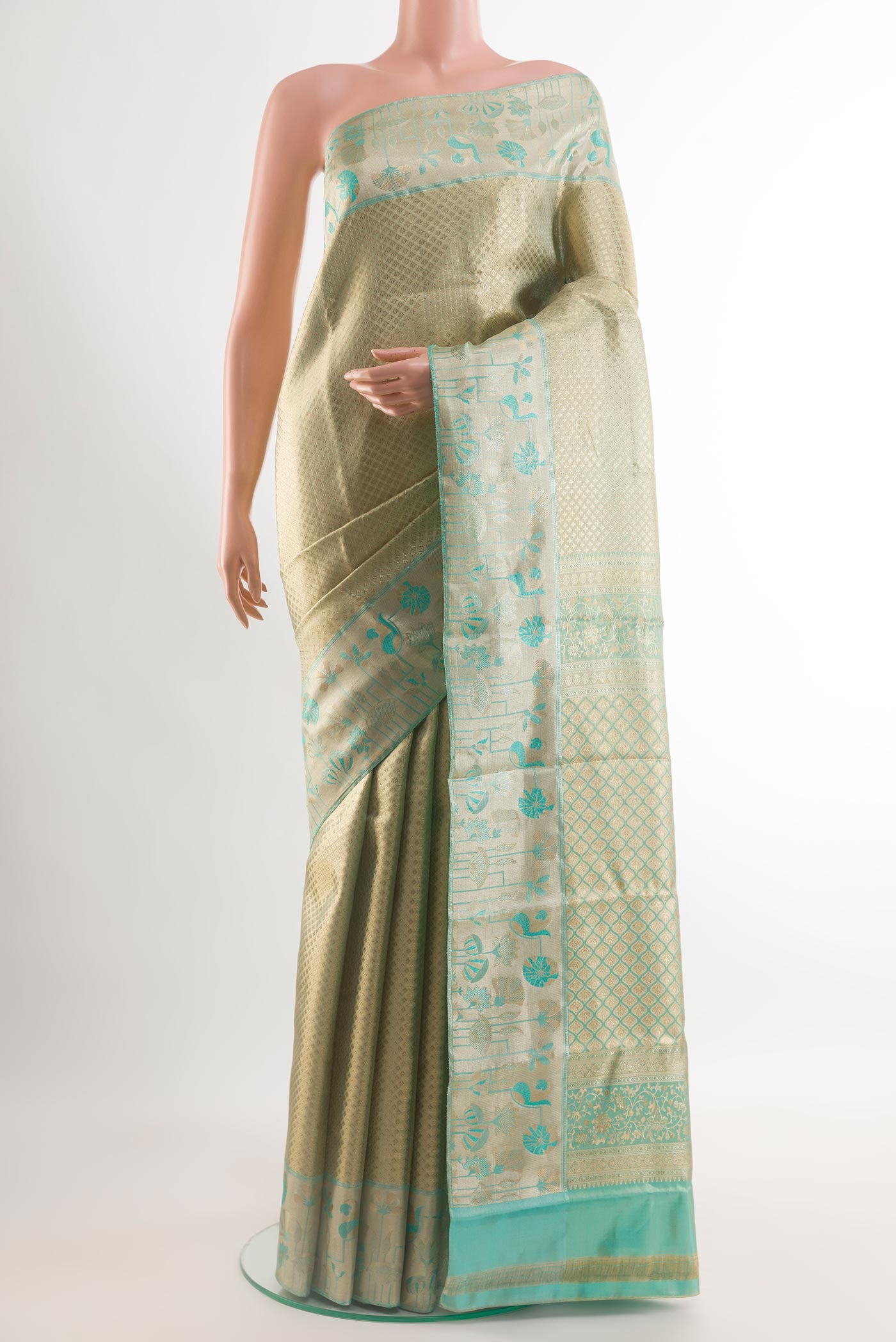 Golden Kanjivaram Tissue Silk Saree with Zari Brocade on the body and Zari Border.  displayed on a mannequin