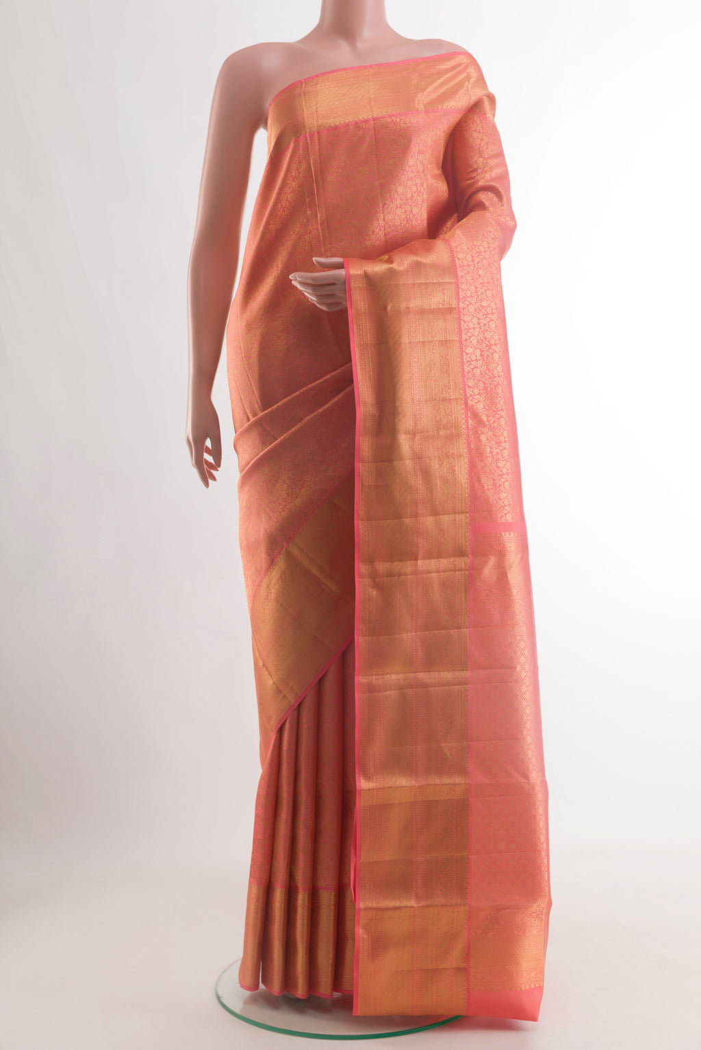 Coral Kanchipuram Silk Saree with Zari Brocade on the body and Zari Border.  displayed on a mannequin