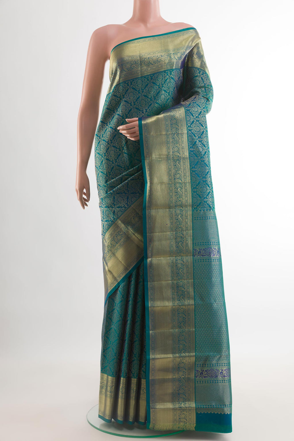 Peacock Blue Dual Tone Kanchipuram Silk Saree with Zari Brocade on the body and Zari Border.  displayed on a mannequin