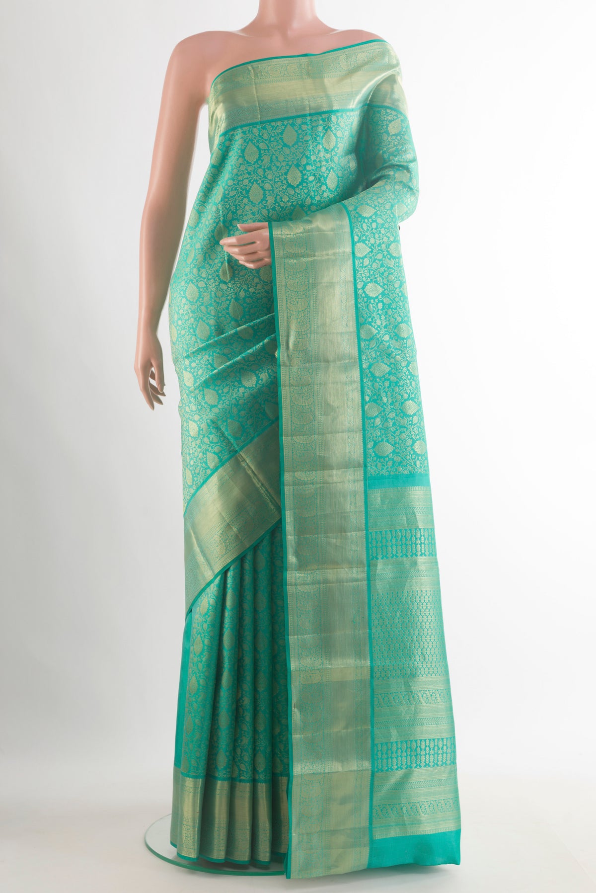 Pure Silk Sea Green Kanchipuram Saree with Zari Brocade on the body and Zari Border.  displayed on a mannequin