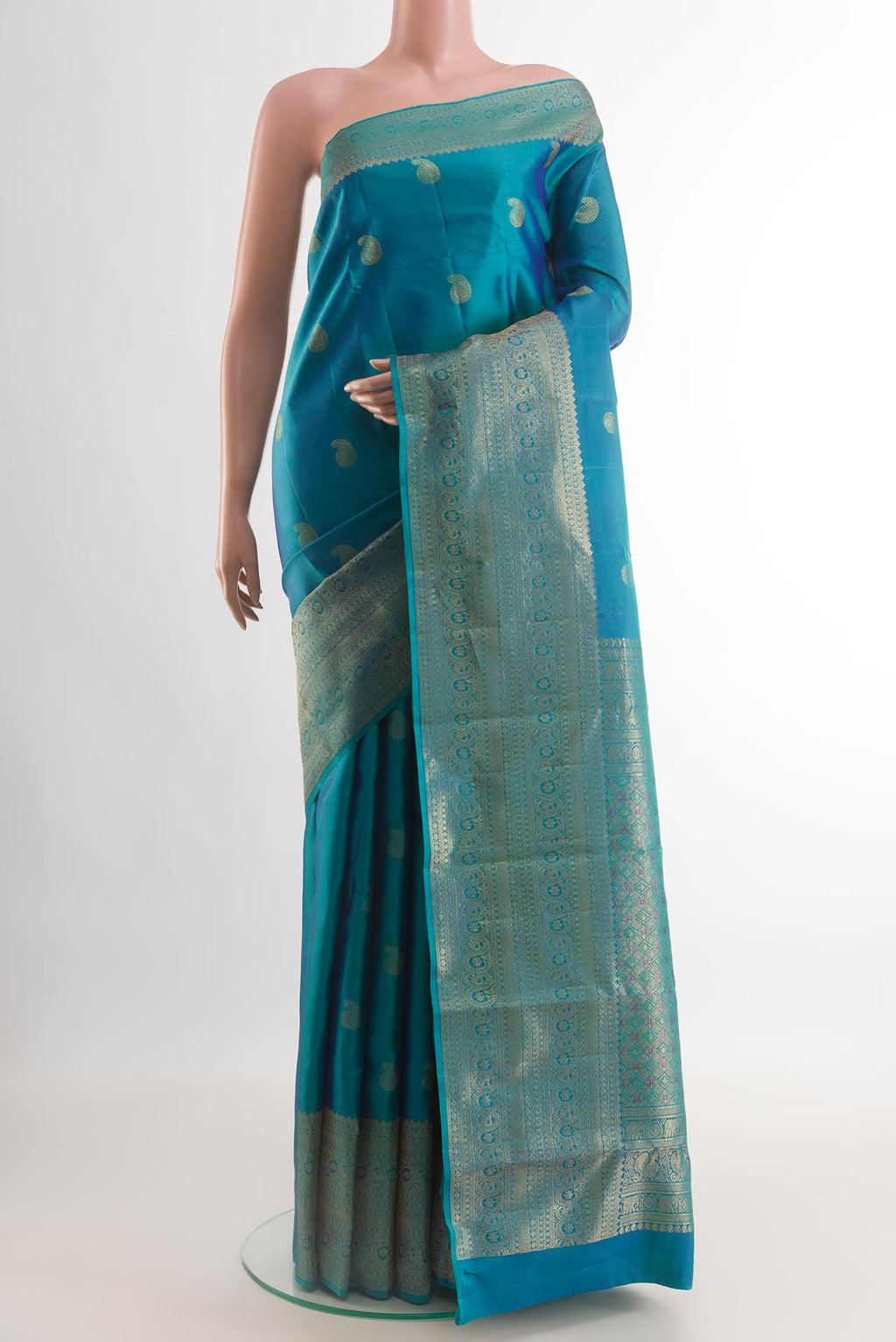 Blue Kanchipuram Silk Saree with Zari Butta on the body and Zari Border.  displayed on a mannequin