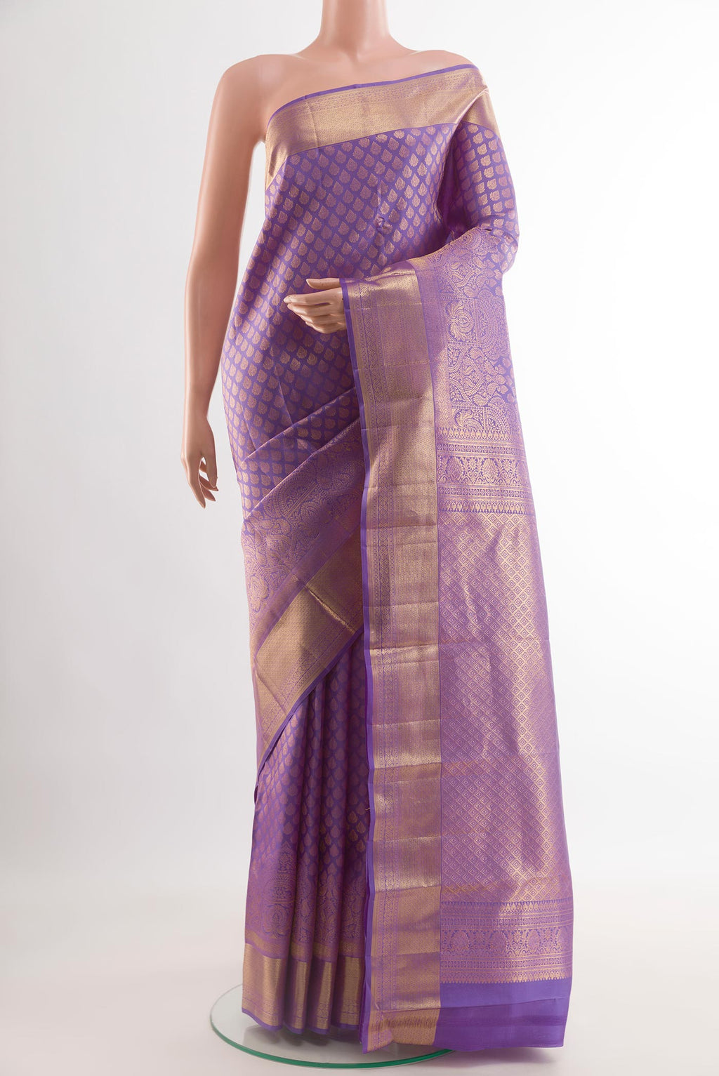 Lavender Kanchipuram Silk Saree with Zari Brocade on the body and Zari Border.  displayed on a mannequin