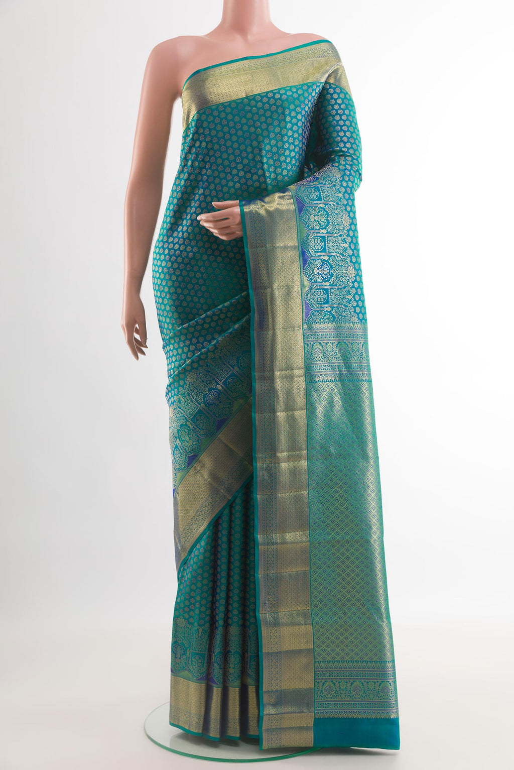 Peacock Blue Kanchipuram Silk Saree with Zari Brocade on the body and Zari Border.  displayed on a mannequin