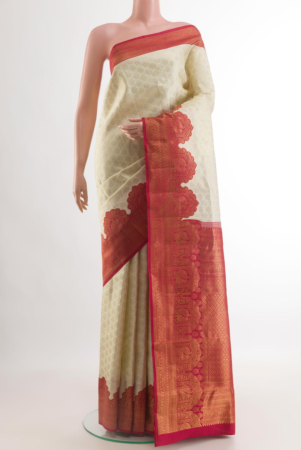 Off White Kanjivaram Silk Saree with Zari Brocade on the body and Zari Border.  displayed on a mannequin