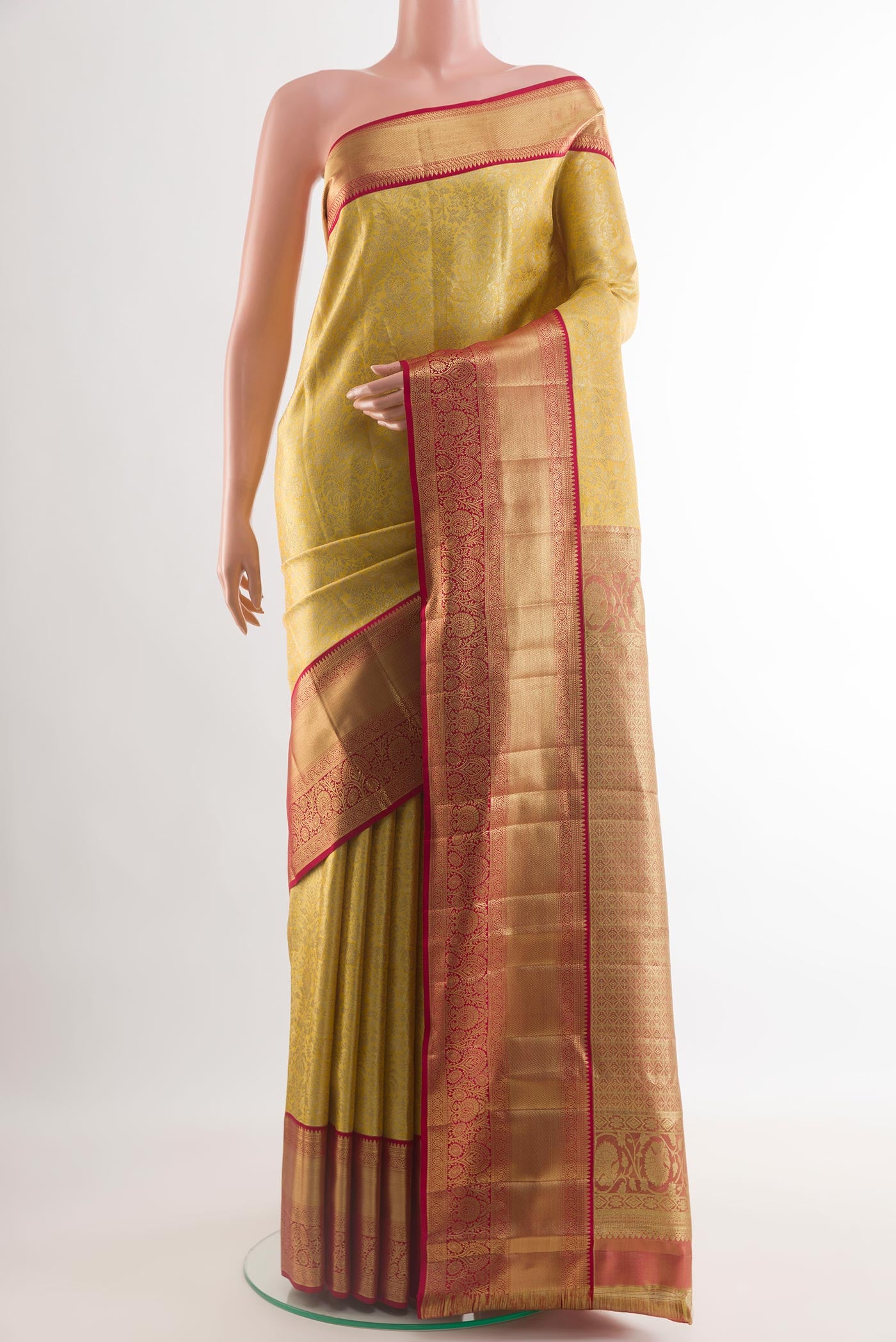 Golden Dual Tone Kanchipuram Tissue Silk Saree with Zari Brocade on the body and Zari Border.  displayed on a mannequin