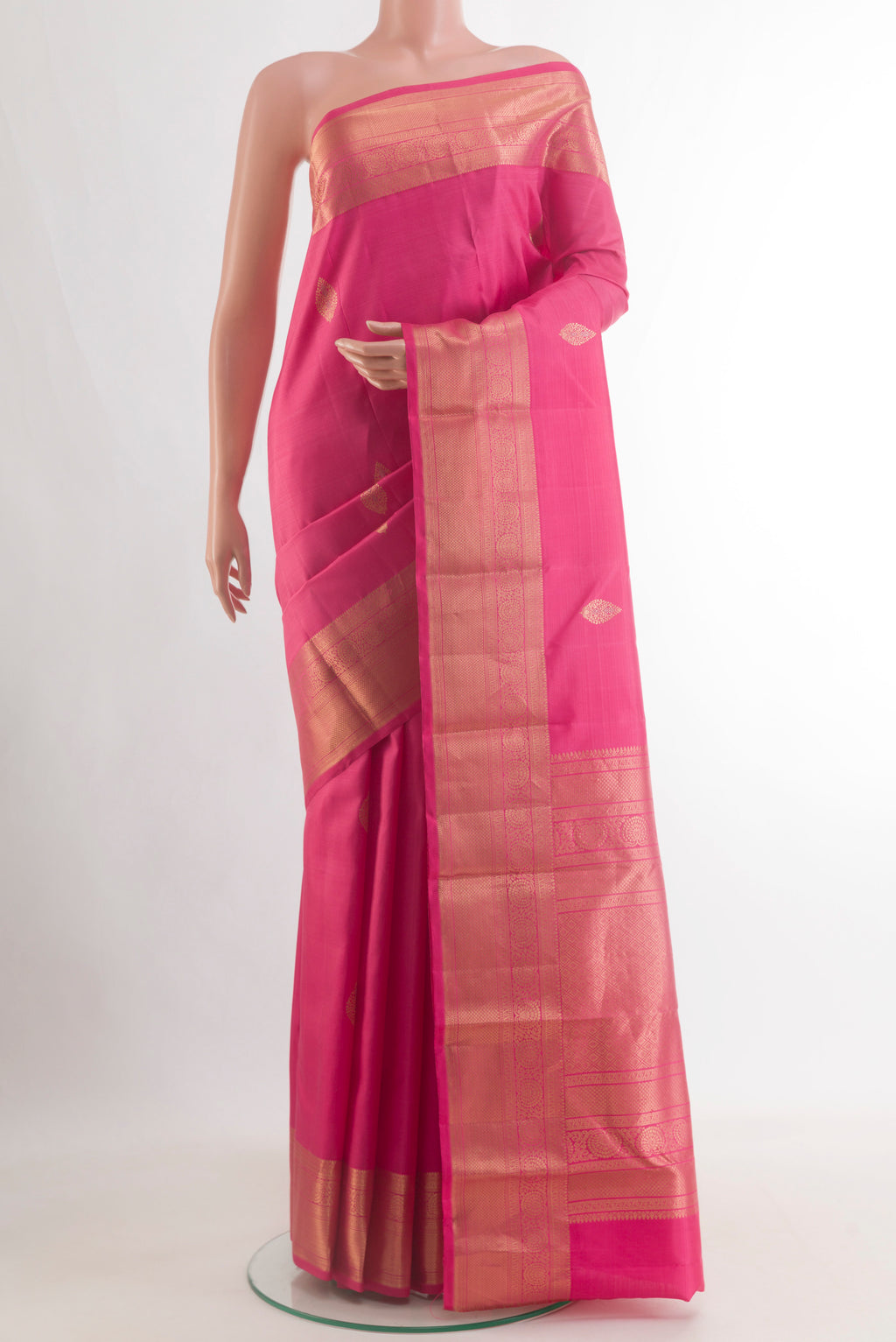 Pure Silk Pink Kanchipuram Saree with Zari Butta on the body and Zari Border.  displayed on a mannequin