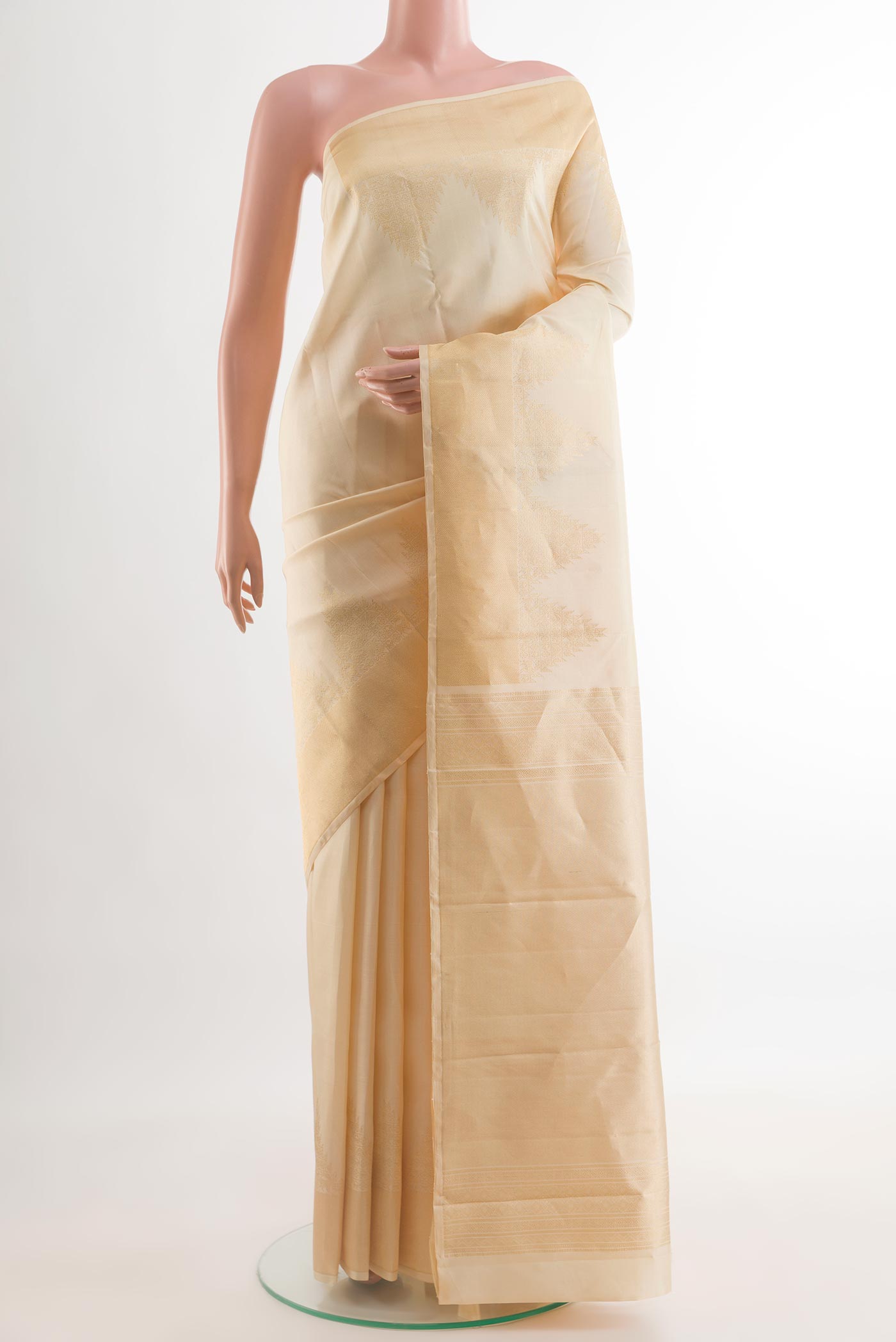 Cream Kanchipuram Silk Saree with Plain Body and Temple Border.  displayed on a mannequin