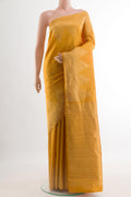 Mustard Kanchipuram Silk Saree with Plain Body and Zari Border.  displayed on a mannequin